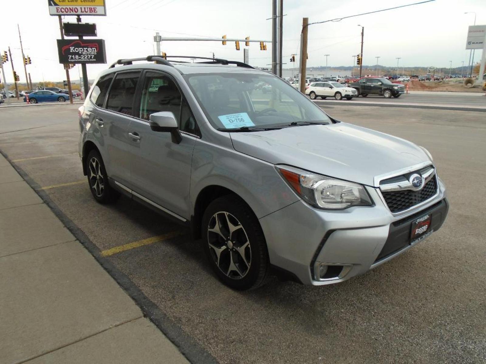 2016 Ice Silver Metallic /Black Subaru Forester 2.0XT Touring (JF2SJGXC1GH) with an 2.0 liter 4 Cylinder Engine engine, Lineartronic CVT transmission, located at 222 N Cambell St., Rapid City, SD, 57701, (866) 420-2727, 44.081833, -103.191032 - This vehicle is a certified CARFAX 1-owner. Our dealership has already run the CARFAX report and it is clean. A clean CARFAX is a great asset for resale value in the future. It is equipped with all wheel drive. This Subaru Forester gleams with an elegant silver clear coated finish. Expand the cargo - Photo #3