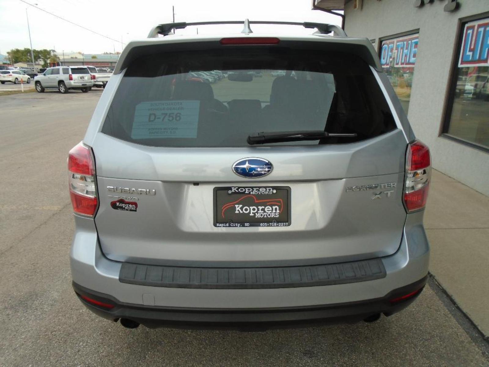 2016 Ice Silver Metallic /Black Subaru Forester 2.0XT Touring (JF2SJGXC1GH) with an 2.0 liter 4 Cylinder Engine engine, Lineartronic CVT transmission, located at 222 N Cambell St., Rapid City, SD, 57701, (866) 420-2727, 44.081833, -103.191032 - This vehicle is a certified CARFAX 1-owner. Our dealership has already run the CARFAX report and it is clean. A clean CARFAX is a great asset for resale value in the future. It is equipped with all wheel drive. This Subaru Forester gleams with an elegant silver clear coated finish. Expand the cargo - Photo #5