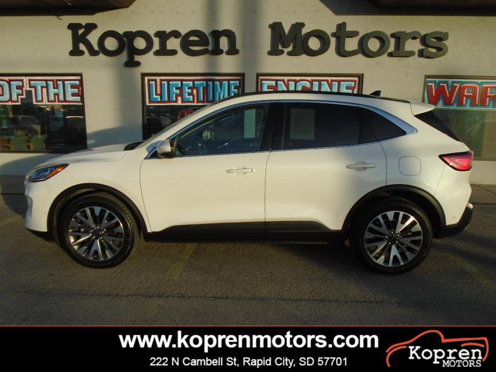 2020 Star White Metallic Tri-Coat Ford Escape Titanium (1FMCU9J93LU) with an 2.0 liter 4 Cylinder Engine engine, 8-SPEED AUTOMATIC transmission, located at 222 N Cambell St., Rapid City, SD, 57701, (866) 420-2727, 44.081833, -103.191032 - Never get into a cold vehicle again with the remote start feature on this small suv. You'll never again be lost in a crowded city or a country region with the navigation system on this 2020 Ford Escape . The state of the art park assist system will guide you easily into any spot. Protect the vehicl - Photo #0