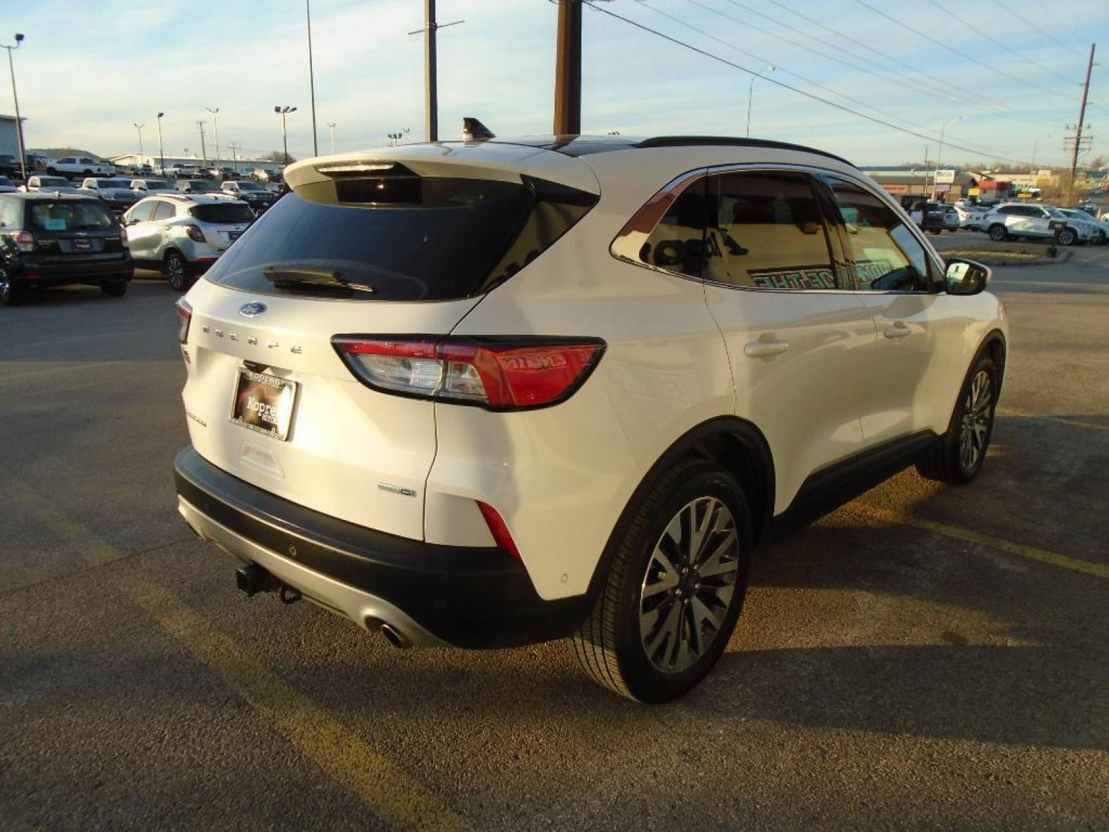 2020 Star White Metallic Tri-Coat Ford Escape Titanium (1FMCU9J93LU) with an 2.0 liter 4 Cylinder Engine engine, 8-SPEED AUTOMATIC transmission, located at 222 N Cambell St., Rapid City, SD, 57701, (866) 420-2727, 44.081833, -103.191032 - Never get into a cold vehicle again with the remote start feature on this small suv. You'll never again be lost in a crowded city or a country region with the navigation system on this 2020 Ford Escape . The state of the art park assist system will guide you easily into any spot. Protect the vehicl - Photo #3