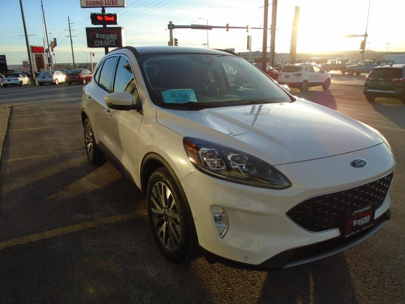 2020 Star White Metallic Tri-Coat Ford Escape Titanium (1FMCU9J93LU) with an 2.0 liter 4 Cylinder Engine engine, 8-SPEED AUTOMATIC transmission, located at 222 N Cambell St., Rapid City, SD, 57701, (866) 420-2727, 44.081833, -103.191032 - Never get into a cold vehicle again with the remote start feature on this small suv. You'll never again be lost in a crowded city or a country region with the navigation system on this 2020 Ford Escape . The state of the art park assist system will guide you easily into any spot. Protect the vehicl - Photo #4
