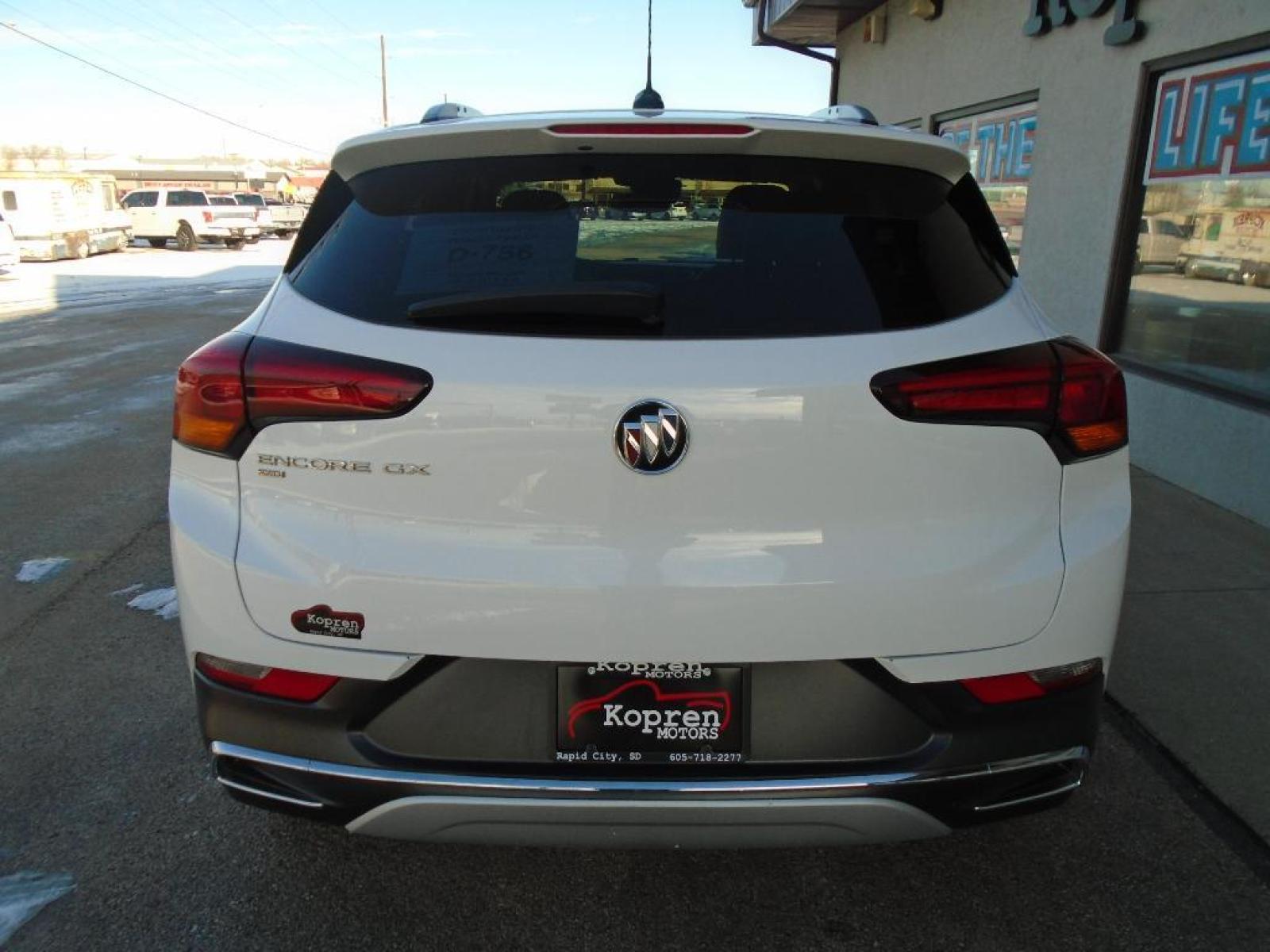 2021 WHITE Buick Encore GX Essence (KL4MMGSL1MB) with an 1.3 liter 3 Cylinder Engine engine, 9-SPEED AUTOMATIC, 9T4X, GEN 1 transmission, located at 222 N Cambell St., Rapid City, SD, 57701, (866) 420-2727, 44.081833, -103.191032 - This vehicle is a certified CARFAX 1-owner. The Buick Encore GX has a clean CARFAX vehicle history report. Protect this unit from unwanted accidents with a cutting edge backup camera system. This unit embodies class and sophistication with its refined white exterior. The vehicle has a 1.3 liter 3 C - Photo #2