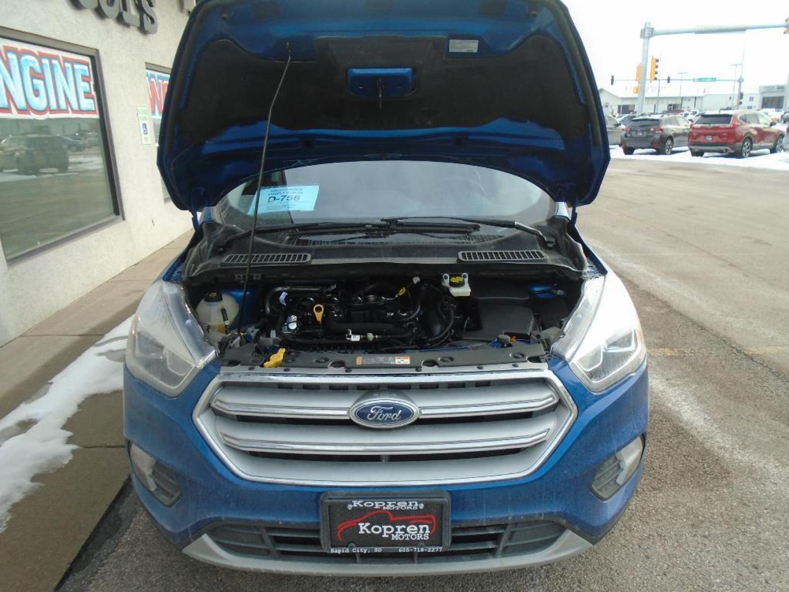 2019 Lightning Blue Metallic Ford Escape SEL (1FMCU9HD4KU) with an 1.5 liter 4 Cylinder Engine engine, 6-SPEED AUTOMATIC W/SELECTSHIFT transmission, located at 222 N Cambell St., Rapid City, SD, 57701, (866) 420-2727, 44.081833, -103.191032 - It has a clean CARFAX vehicle history report. The state of the art park assist system will guide you easily into any spot. Protect this unit from unwanted accidents with a cutting edge backup camera system. Never get into a cold vehicle again with the remote start feature on this unit. This vehicle - Photo #32