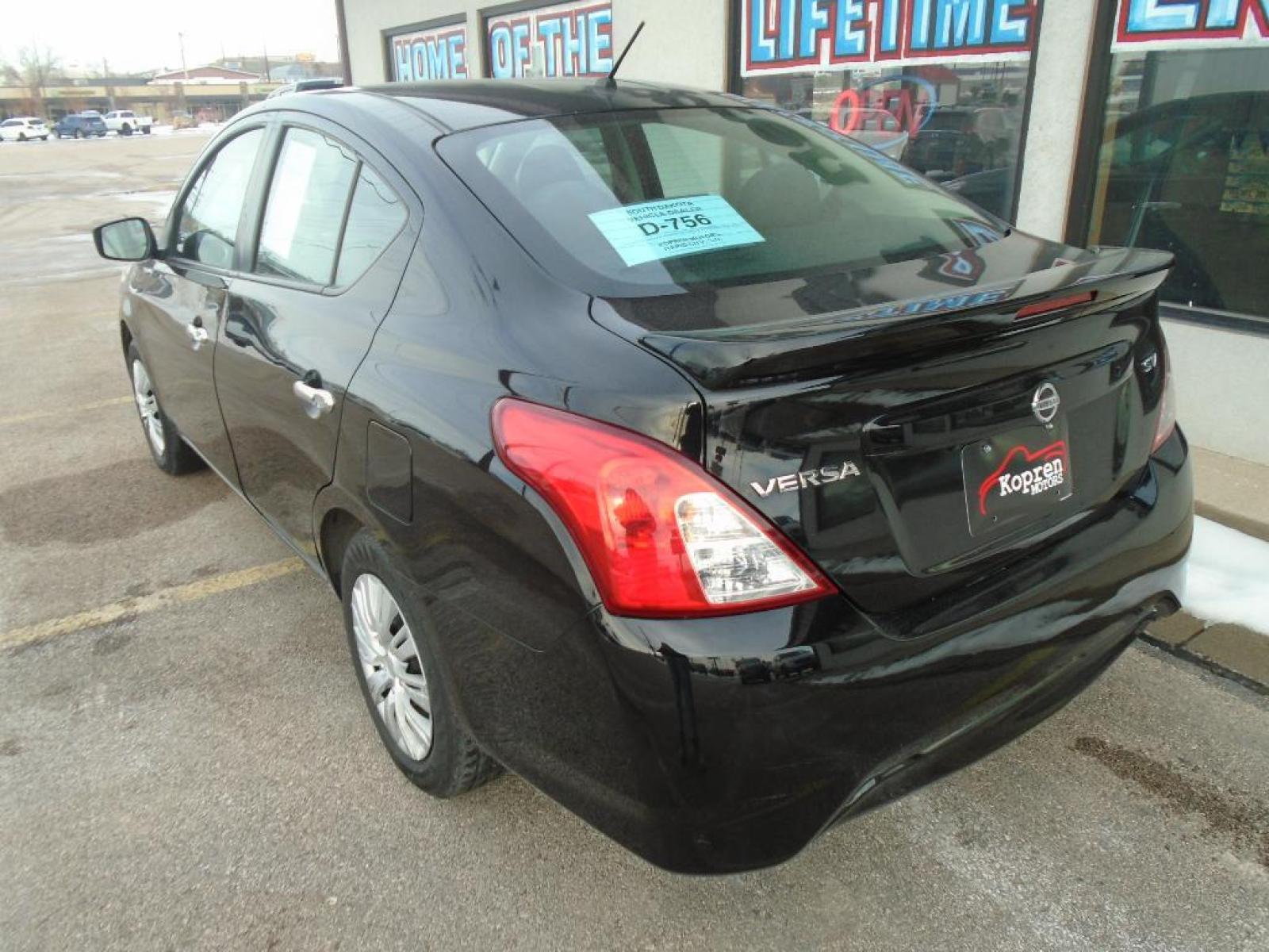 2019 Super Black /Charcoal Nissan Versa SV (3N1CN7AP8KL) with an 1.6 liter 4 Cylinder Engine engine, Xtronic CVT transmission, located at 222 N Cambell St., Rapid City, SD, 57701, (866) 420-2727, 44.081833, -103.191032 - See what's behind you with the back up camera on this small car. It features a hands-free Bluetooth phone system. This model is painted with a sleek and sophisticated black color. This Nissan Versa has a 1.6 liter 4 Cylinder Engine high output engine. It is front wheel drive. This vehicle is equippe - Photo #1