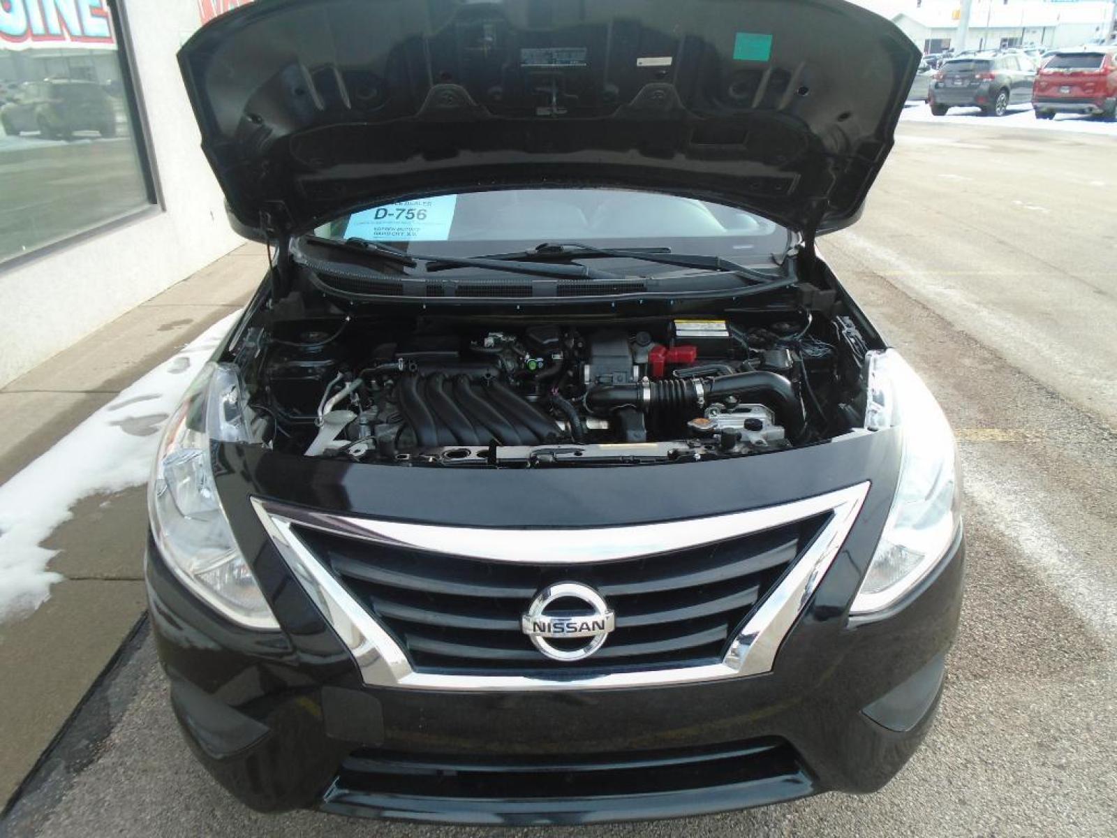 2019 Super Black /Charcoal Nissan Versa SV (3N1CN7AP8KL) with an 1.6 liter 4 Cylinder Engine engine, Xtronic CVT transmission, located at 222 N Cambell St., Rapid City, SD, 57701, (866) 420-2727, 44.081833, -103.191032 - See what's behind you with the back up camera on this small car. It features a hands-free Bluetooth phone system. This model is painted with a sleek and sophisticated black color. This Nissan Versa has a 1.6 liter 4 Cylinder Engine high output engine. It is front wheel drive. This vehicle is equippe - Photo #29