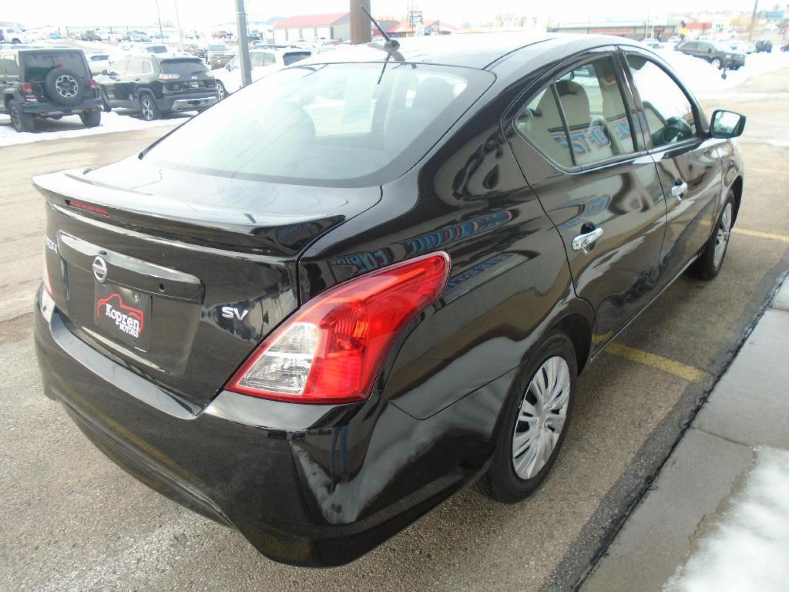 2019 Super Black /Charcoal Nissan Versa SV (3N1CN7AP8KL) with an 1.6 liter 4 Cylinder Engine engine, Xtronic CVT transmission, located at 222 N Cambell St., Rapid City, SD, 57701, (866) 420-2727, 44.081833, -103.191032 - See what's behind you with the back up camera on this small car. It features a hands-free Bluetooth phone system. This model is painted with a sleek and sophisticated black color. This Nissan Versa has a 1.6 liter 4 Cylinder Engine high output engine. It is front wheel drive. This vehicle is equippe - Photo #3