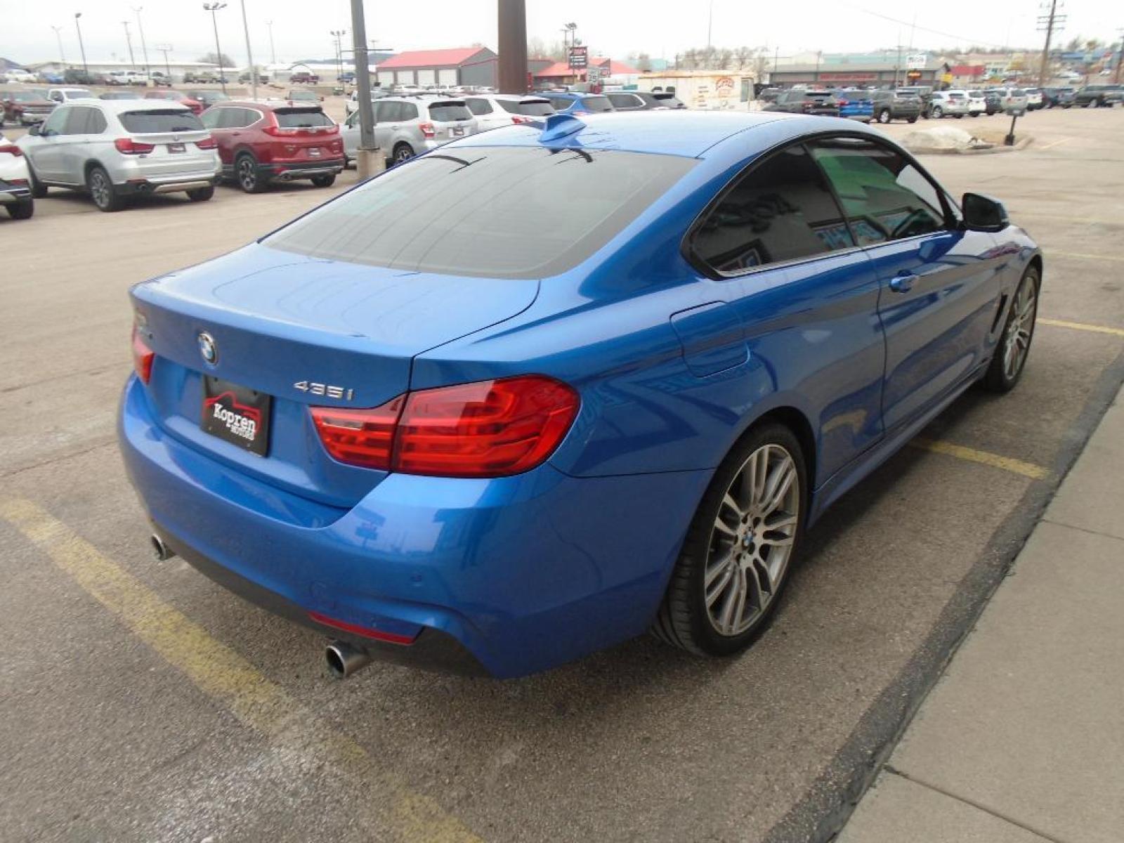 2014 BLUE BMW 4 series 435i xDrive (WBA3R5C58EF) with an 3.0 liter Straight 6 Cylinder Engine engine, Automatic transmission, located at 222 N Cambell St., Rapid City, SD, 57701, (866) 420-2727, 44.081833, -103.191032 - This 2014 BMW 4 series has a 3.0 liter Straight 6 Cylinder Engine high output engine. This small car shines with an exquisite blue finish. This model is equipped with all wheel drive. This BMW 4 series is equipped with a gasoline engine. The high efficiency automatic transmission shifts smoothly an - Photo #3
