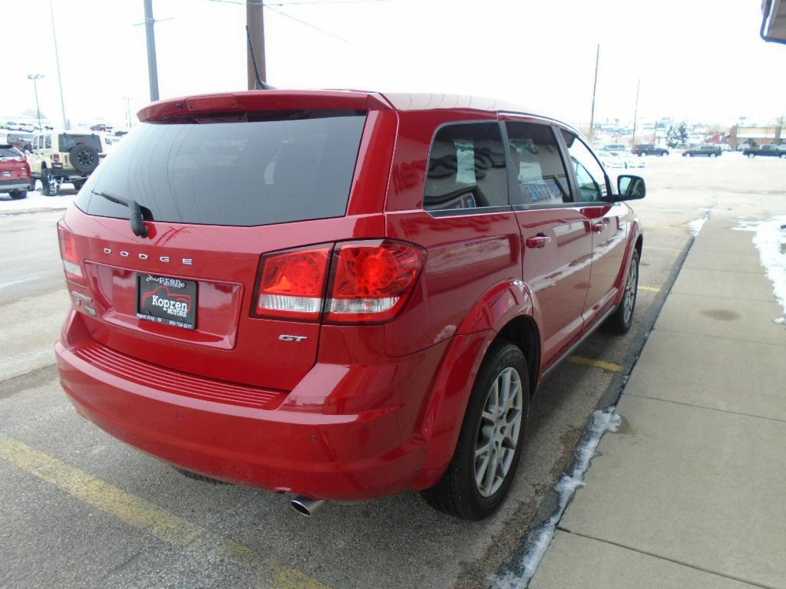 2019 Redline 2 Coat Pearl /Black/Red Dodge Journey GT (3C4PDDEG0KT) with an 3.6 liter V6 Cylinder Engine engine, 6-SPEED AUTOMATIC 62TE transmission, located at 222 N Cambell St., Rapid City, SD, 57701, (866) 420-2727, 44.081833, -103.191032 - This vehicle features a hands-free Bluetooth phone system. See what's behind you with the back up camera on this Dodge Journey. This Dodge Journey has a 3.6 liter V6 Cylinder Engine high output engine. The Dodge Journey gleams with a flashy red exterior. This model comes with third row seating for e - Photo #3
