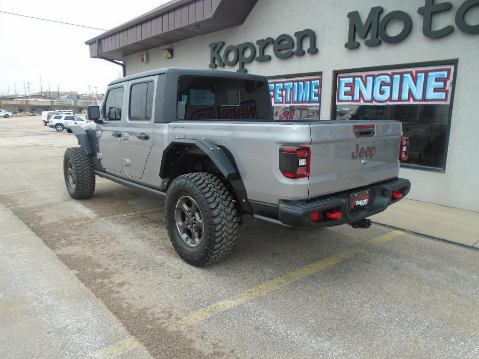 2020 Billet Silver Metallic Clearcoat /Black Jeep Gladiator Rubicon 4X4 (1C6JJTBG8LL) with an V6, 3.6L engine, 8-speed automatic transmission, located at 222 N Cambell St., Rapid City, SD, 57701, (866) 420-2727, 44.081833, -103.191032 - <b>Equipment</b><br>The installed navigation system will keep you on the right path. This 2020 Jeep Gladiator is pure luxury with a heated steering wheel. See what's behind you with the back up camera on the Jeep Gladiator. This vehicle is a certified CARFAX 1-owner. Bluetooth technology is built i - Photo #1