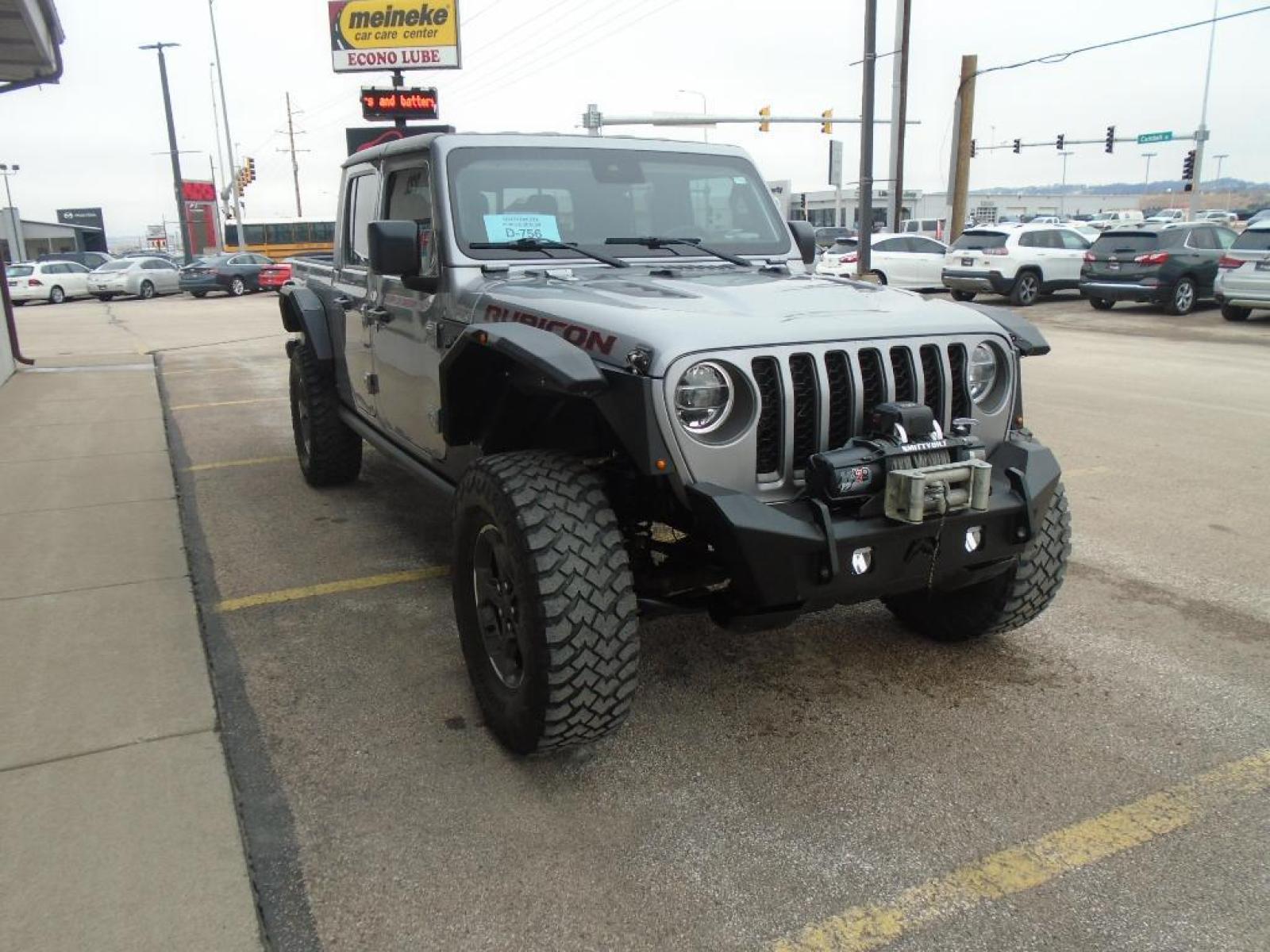 2020 Billet Silver Metallic Clearcoat /Black Jeep Gladiator Rubicon 4X4 (1C6JJTBG8LL) with an V6, 3.6L engine, 8-speed automatic transmission, located at 222 N Cambell St., Rapid City, SD, 57701, (866) 420-2727, 44.081833, -103.191032 - <b>Equipment</b><br>The installed navigation system will keep you on the right path. This 2020 Jeep Gladiator is pure luxury with a heated steering wheel. See what's behind you with the back up camera on the Jeep Gladiator. This vehicle is a certified CARFAX 1-owner. Bluetooth technology is built i - Photo #4
