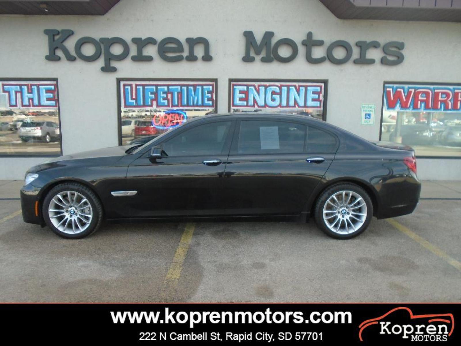 2015 BLACK BMW 7 series 750Li xDrive (WBAYF8C54FG) with an 4.4 liter 8 Cylinder Engine engine, Automatic transmission, located at 222 N Cambell St., Rapid City, SD, 57701, (866) 420-2727, 44.081833, -103.191032 - This vehicle is a certified CARFAX 1-owner. The rear parking assist technology on this 2015 BMW 7 series will put you at ease when reversing. The system alerts you as you get closer to an obstruction. See what's behind you with the back up camera on the BMW 7 series. This model has a 4.4 liter 8 C - Photo #0