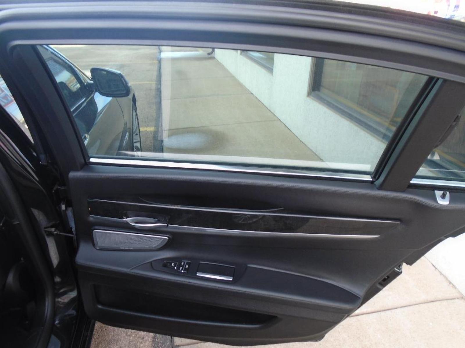 2015 BLACK BMW 7 series 750Li xDrive (WBAYF8C54FG) with an 4.4 liter 8 Cylinder Engine engine, Automatic transmission, located at 222 N Cambell St., Rapid City, SD, 57701, (866) 420-2727, 44.081833, -103.191032 - This vehicle is a certified CARFAX 1-owner. The rear parking assist technology on this 2015 BMW 7 series will put you at ease when reversing. The system alerts you as you get closer to an obstruction. See what's behind you with the back up camera on the BMW 7 series. This model has a 4.4 liter 8 C - Photo #28