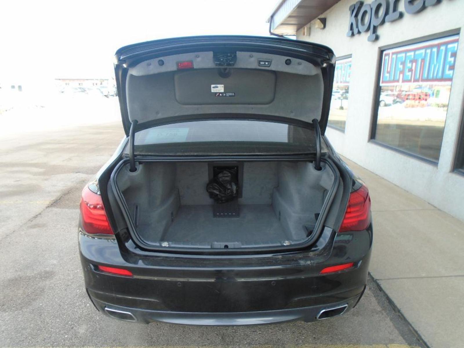 2015 BLACK BMW 7 series 750Li xDrive (WBAYF8C54FG) with an 4.4 liter 8 Cylinder Engine engine, Automatic transmission, located at 222 N Cambell St., Rapid City, SD, 57701, (866) 420-2727, 44.081833, -103.191032 - This vehicle is a certified CARFAX 1-owner. The rear parking assist technology on this 2015 BMW 7 series will put you at ease when reversing. The system alerts you as you get closer to an obstruction. See what's behind you with the back up camera on the BMW 7 series. This model has a 4.4 liter 8 C - Photo #33