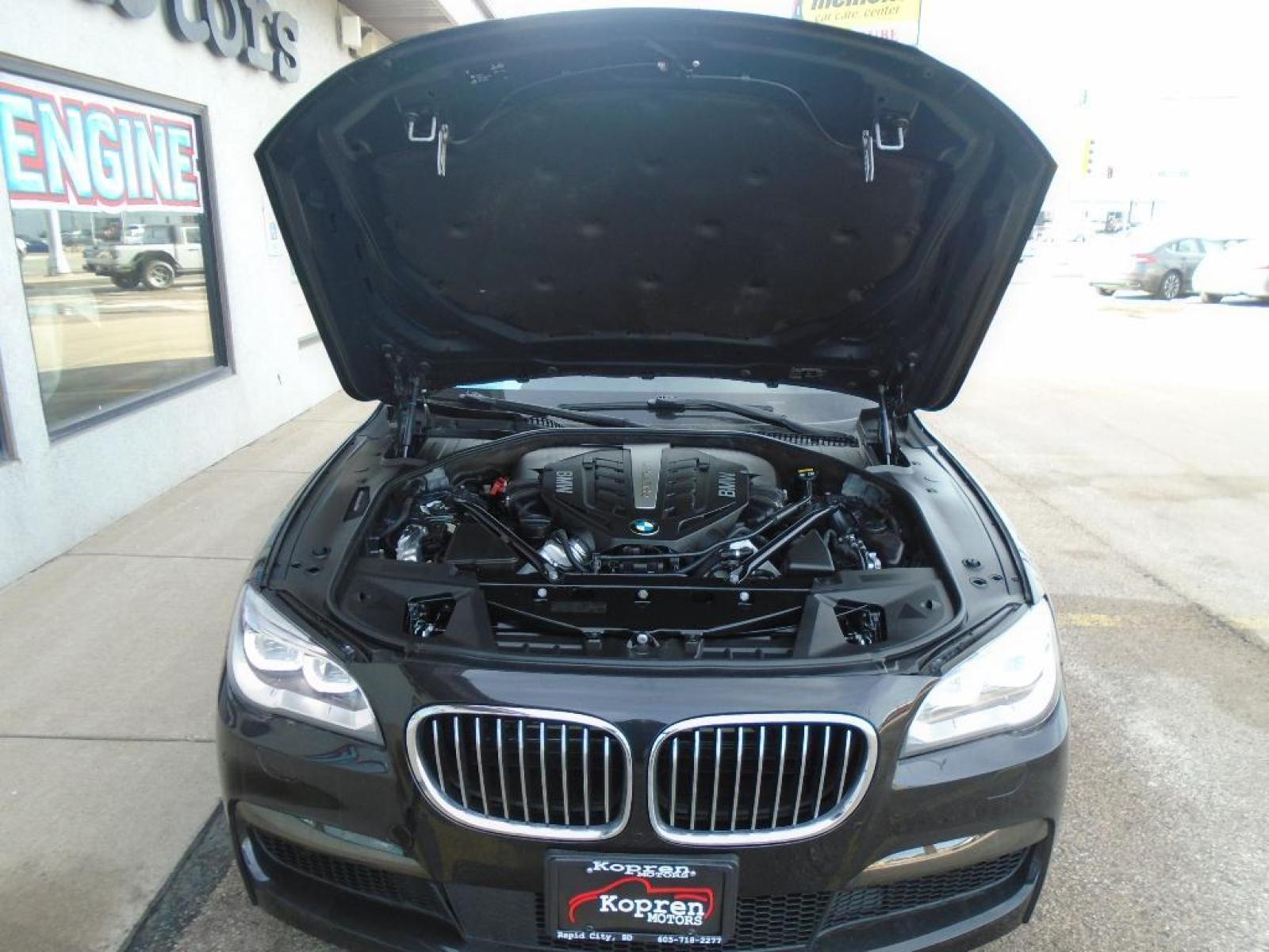 2015 BLACK BMW 7 series 750Li xDrive (WBAYF8C54FG) with an 4.4 liter 8 Cylinder Engine engine, Automatic transmission, located at 222 N Cambell St., Rapid City, SD, 57701, (866) 420-2727, 44.081833, -103.191032 - This vehicle is a certified CARFAX 1-owner. The rear parking assist technology on this 2015 BMW 7 series will put you at ease when reversing. The system alerts you as you get closer to an obstruction. See what's behind you with the back up camera on the BMW 7 series. This model has a 4.4 liter 8 C - Photo #36