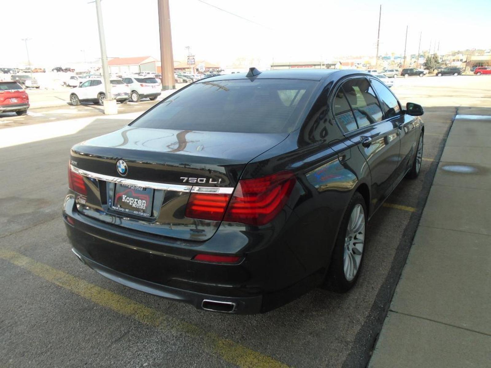 2015 BLACK BMW 7 series 750Li xDrive (WBAYF8C54FG) with an 4.4 liter 8 Cylinder Engine engine, Automatic transmission, located at 222 N Cambell St., Rapid City, SD, 57701, (866) 420-2727, 44.081833, -103.191032 - This vehicle is a certified CARFAX 1-owner. The rear parking assist technology on this 2015 BMW 7 series will put you at ease when reversing. The system alerts you as you get closer to an obstruction. See what's behind you with the back up camera on the BMW 7 series. This model has a 4.4 liter 8 C - Photo #3