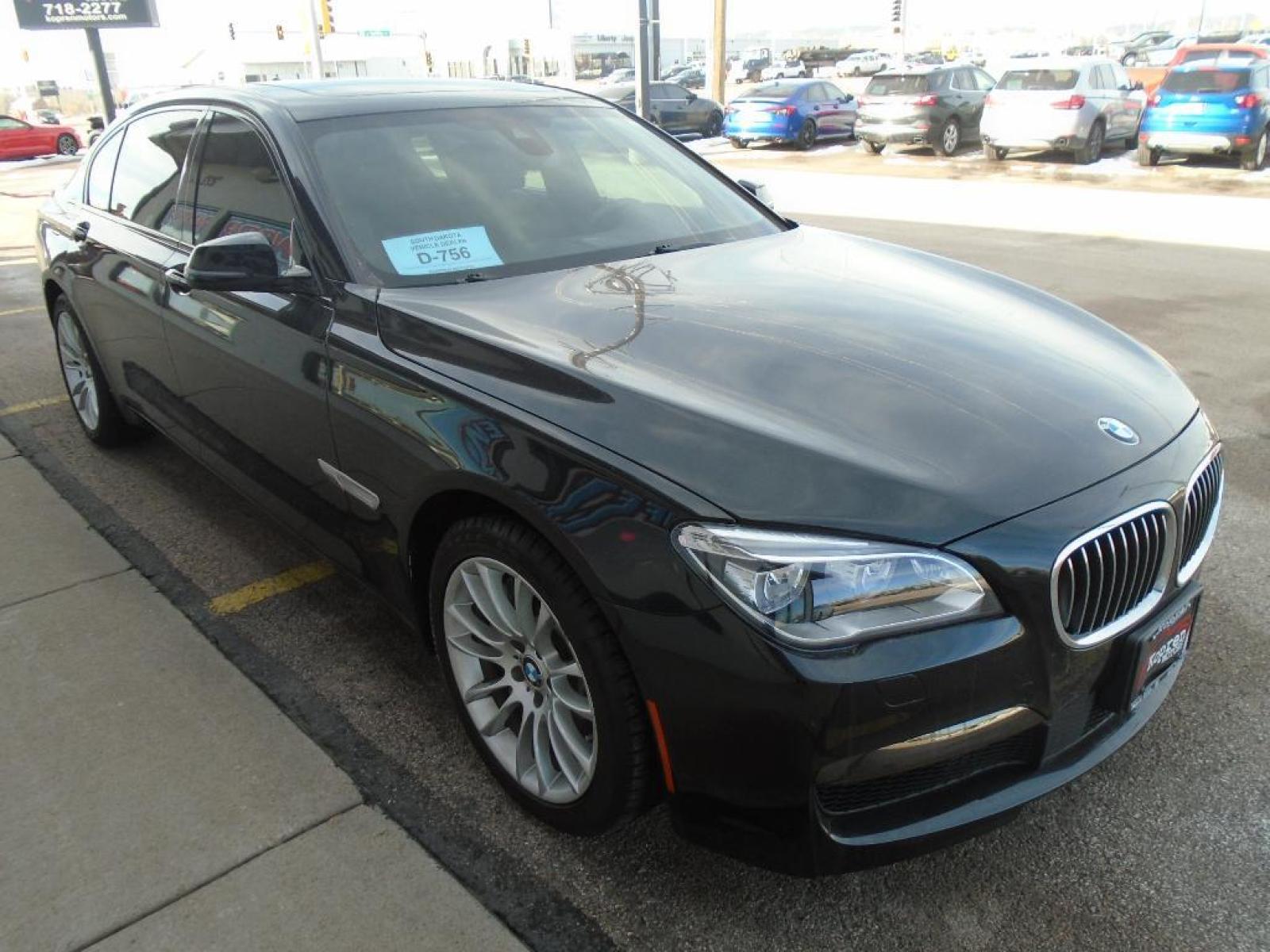 2015 BLACK BMW 7 series 750Li xDrive (WBAYF8C54FG) with an 4.4 liter 8 Cylinder Engine engine, Automatic transmission, located at 222 N Cambell St., Rapid City, SD, 57701, (866) 420-2727, 44.081833, -103.191032 - This vehicle is a certified CARFAX 1-owner. The rear parking assist technology on this 2015 BMW 7 series will put you at ease when reversing. The system alerts you as you get closer to an obstruction. See what's behind you with the back up camera on the BMW 7 series. This model has a 4.4 liter 8 C - Photo #4
