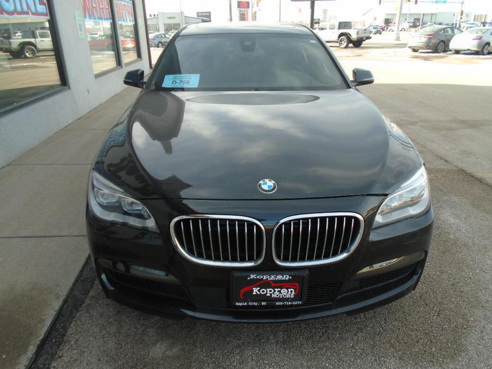 2015 BLACK BMW 7 series 750Li xDrive (WBAYF8C54FG) with an 4.4 liter 8 Cylinder Engine engine, Automatic transmission, located at 222 N Cambell St., Rapid City, SD, 57701, (866) 420-2727, 44.081833, -103.191032 - This vehicle is a certified CARFAX 1-owner. The rear parking assist technology on this 2015 BMW 7 series will put you at ease when reversing. The system alerts you as you get closer to an obstruction. See what's behind you with the back up camera on the BMW 7 series. This model has a 4.4 liter 8 C - Photo #5