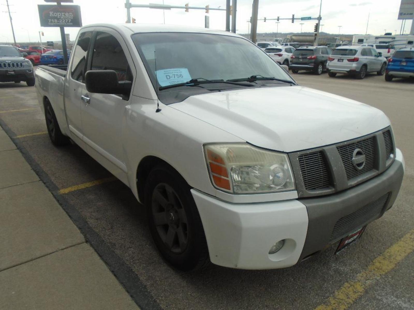 2006 WHITE Nissan Titan SE (1N6BA06A06N) with an 5.6 liter 8 Cylinder Engine engine, located at 222 N Cambell St., Rapid City, SD, 57701, (866) 420-2727, 44.081833, -103.191032 - This 2006 Nissan Titan shines with clean polished lines coated with an elegant white finish. Enjoy the incredible handling with the rear wheel drive on this Nissan Titan. The vehicle has a 5.6 liter 8 Cylinder Engine high output engine. Anti-lock brakes are standard on this unit. Easily set your sp - Photo #4