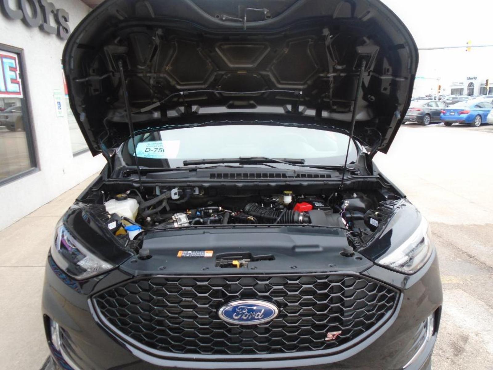 2022 Agate Black Metallic /Ebony Ford Edge ST (2FMPK4AP7NB) with an 2.7 liter V6 Cylinder Engine engine, 7-SPEED AUTOMATIC W/SELECTSHIFT transmission, located at 222 N Cambell St., Rapid City, SD, 57701, (866) 420-2727, 44.081833, -103.191032 - This vehicle is a certified CARFAX 1-owner. The rear parking assist technology on the vehicle will put you at ease when reversing. The system alerts you as you get closer to an obstruction. See what's behind you with the back up camera on this model. It has a clean CARFAX vehicle history report. Th - Photo #36