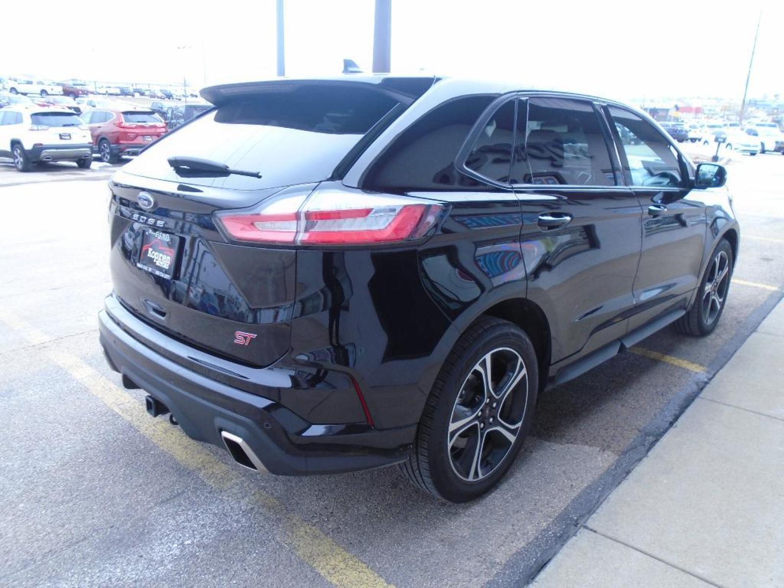 2022 Agate Black Metallic /Ebony Ford Edge ST (2FMPK4AP7NB) with an 2.7 liter V6 Cylinder Engine engine, 7-SPEED AUTOMATIC W/SELECTSHIFT transmission, located at 222 N Cambell St., Rapid City, SD, 57701, (866) 420-2727, 44.081833, -103.191032 - This vehicle is a certified CARFAX 1-owner. The rear parking assist technology on the vehicle will put you at ease when reversing. The system alerts you as you get closer to an obstruction. See what's behind you with the back up camera on this model. It has a clean CARFAX vehicle history report. Th - Photo #3