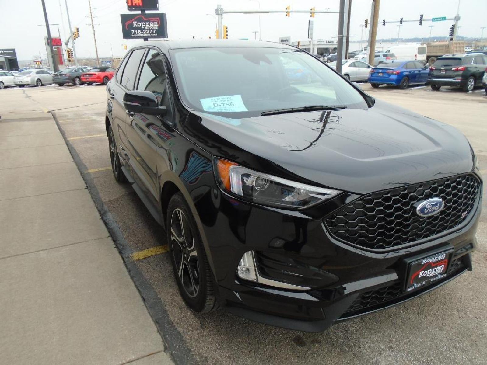 2022 Agate Black Metallic /Ebony Ford Edge ST (2FMPK4AP7NB) with an 2.7 liter V6 Cylinder Engine engine, 7-SPEED AUTOMATIC W/SELECTSHIFT transmission, located at 222 N Cambell St., Rapid City, SD, 57701, (866) 420-2727, 44.081833, -103.191032 - This vehicle is a certified CARFAX 1-owner. The rear parking assist technology on the vehicle will put you at ease when reversing. The system alerts you as you get closer to an obstruction. See what's behind you with the back up camera on this model. It has a clean CARFAX vehicle history report. Th - Photo #4