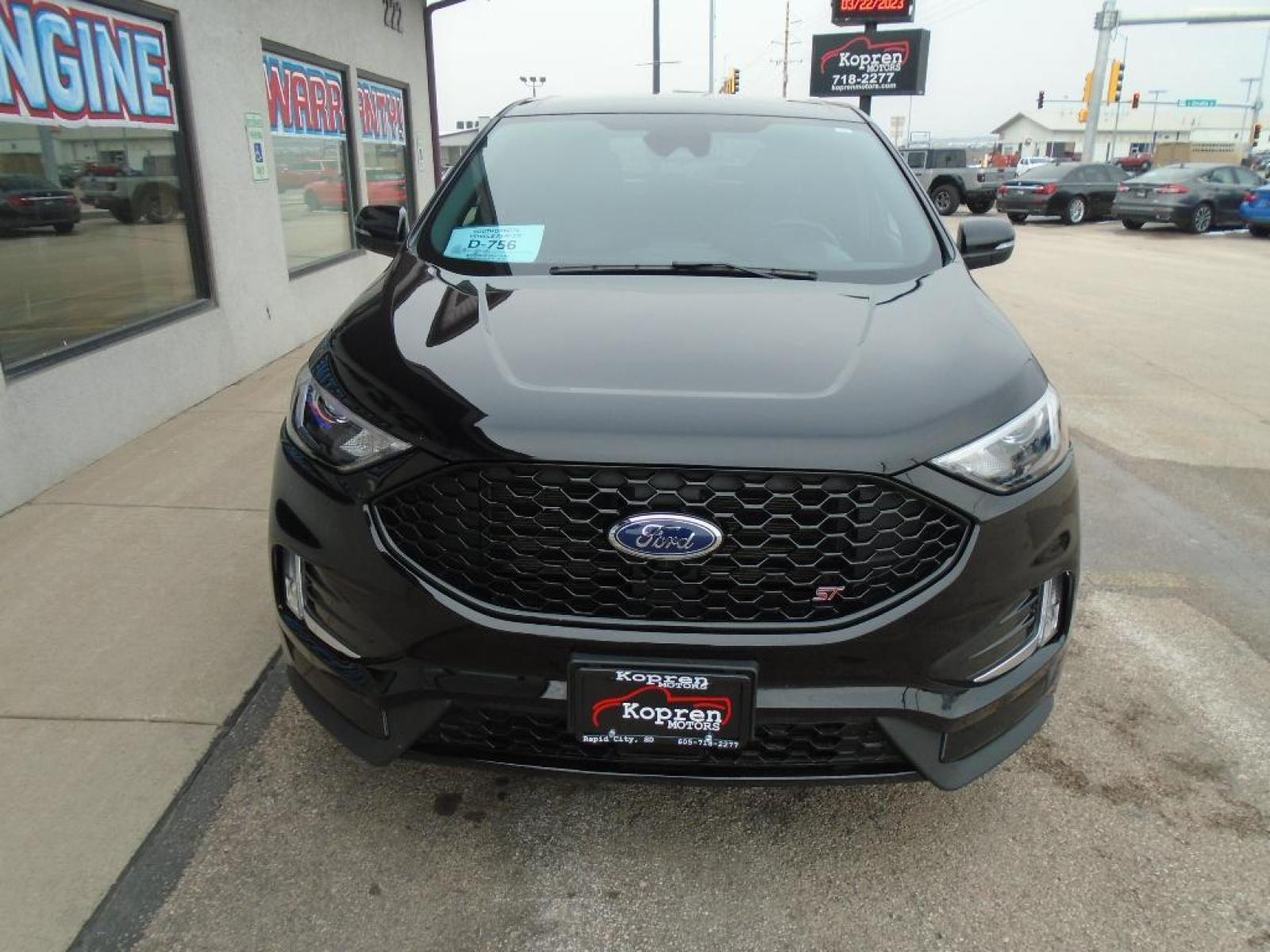 2022 Agate Black Metallic /Ebony Ford Edge ST (2FMPK4AP7NB) with an 2.7 liter V6 Cylinder Engine engine, 7-SPEED AUTOMATIC W/SELECTSHIFT transmission, located at 222 N Cambell St., Rapid City, SD, 57701, (866) 420-2727, 44.081833, -103.191032 - This vehicle is a certified CARFAX 1-owner. The rear parking assist technology on the vehicle will put you at ease when reversing. The system alerts you as you get closer to an obstruction. See what's behind you with the back up camera on this model. It has a clean CARFAX vehicle history report. Th - Photo #5