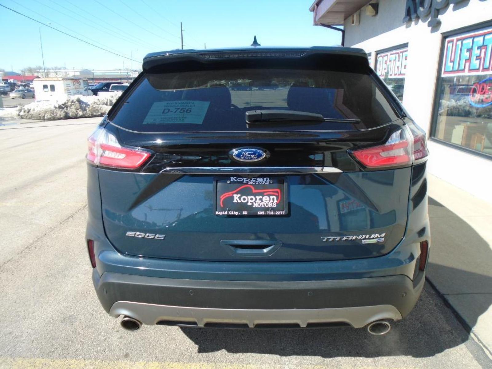 2019 Baltic Sea Green Metallic Ford Edge Titanium (2FMPK4K94KB) with an 2.0 liter 4 Cylinder Engine engine, 8-SPEED AUTOMATIC W/SELECTSHIFT transmission, located at 222 N Cambell St., Rapid City, SD, 57701, (866) 420-2727, 44.081833, -103.191032 - This vehicle is a certified CARFAX 1-owner. See what's behind you with the back up camera on it. The rear parking assist technology on it will put you at ease when reversing. The system alerts you as you get closer to an obstruction. This model features a hands-free Bluetooth phone system. This uni - Photo #2