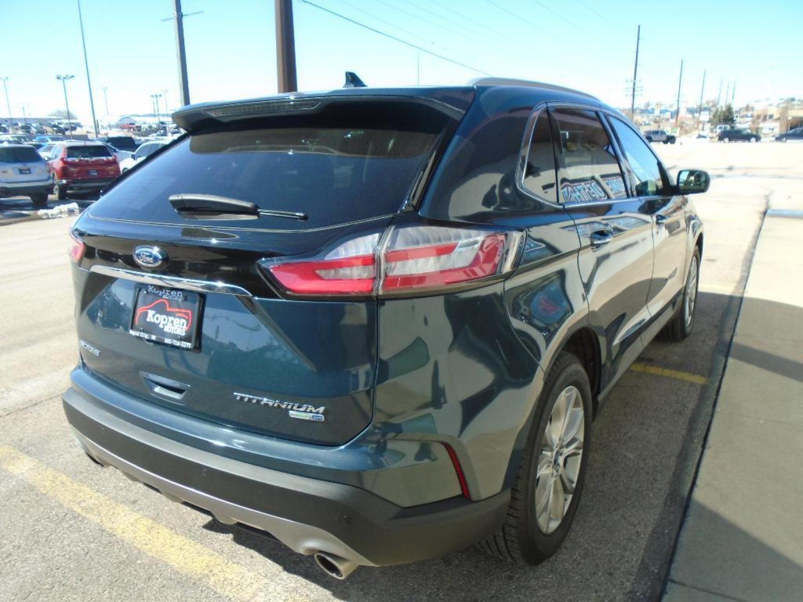 2019 Baltic Sea Green Metallic Ford Edge Titanium (2FMPK4K94KB) with an 2.0 liter 4 Cylinder Engine engine, 8-SPEED AUTOMATIC W/SELECTSHIFT transmission, located at 222 N Cambell St., Rapid City, SD, 57701, (866) 420-2727, 44.081833, -103.191032 - This vehicle is a certified CARFAX 1-owner. See what's behind you with the back up camera on it. The rear parking assist technology on it will put you at ease when reversing. The system alerts you as you get closer to an obstruction. This model features a hands-free Bluetooth phone system. This uni - Photo #3