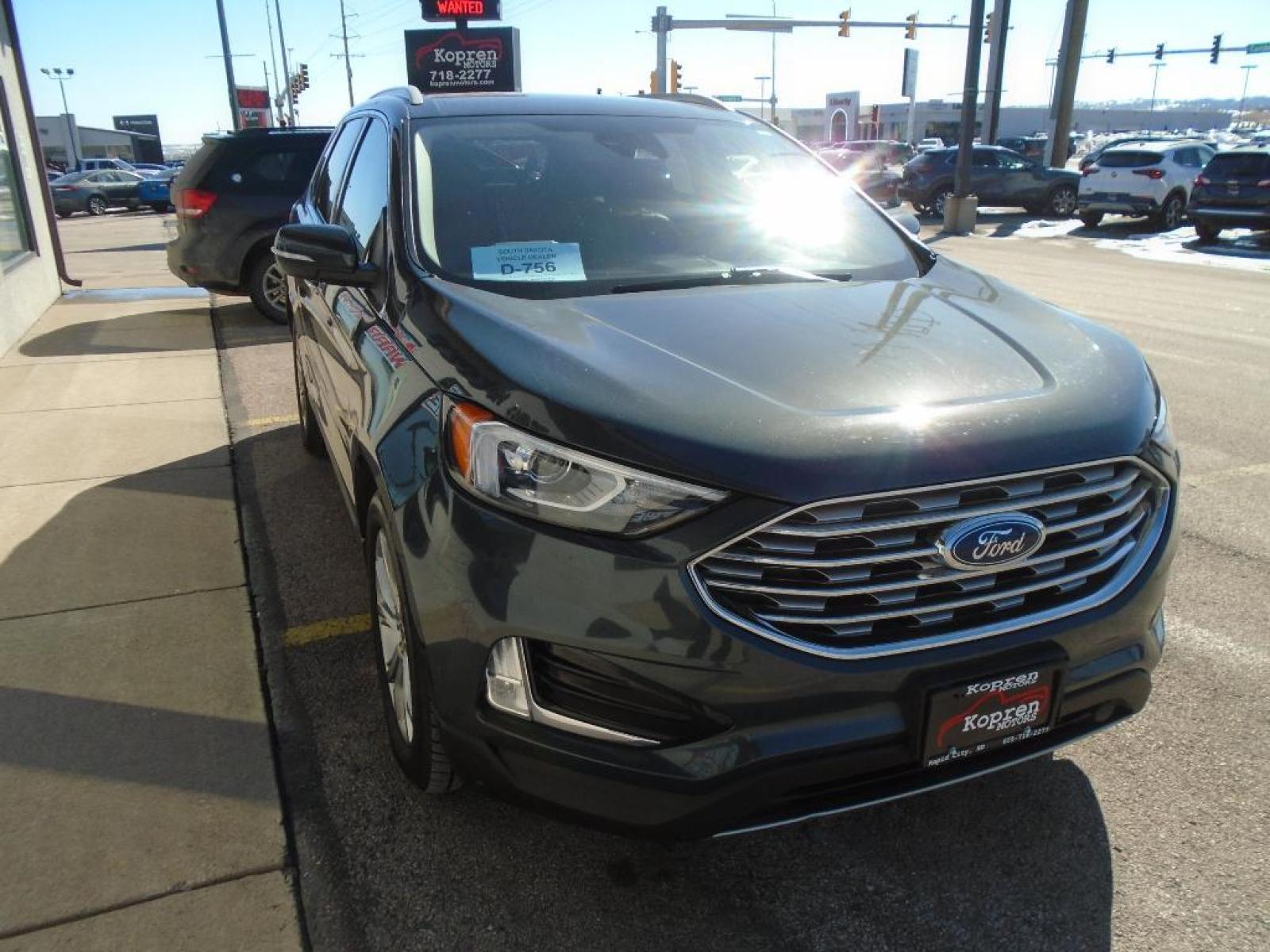 2019 Baltic Sea Green Metallic Ford Edge Titanium (2FMPK4K94KB) with an 2.0 liter 4 Cylinder Engine engine, 8-SPEED AUTOMATIC W/SELECTSHIFT transmission, located at 222 N Cambell St., Rapid City, SD, 57701, (866) 420-2727, 44.081833, -103.191032 - This vehicle is a certified CARFAX 1-owner. See what's behind you with the back up camera on it. The rear parking assist technology on it will put you at ease when reversing. The system alerts you as you get closer to an obstruction. This model features a hands-free Bluetooth phone system. This uni - Photo #4