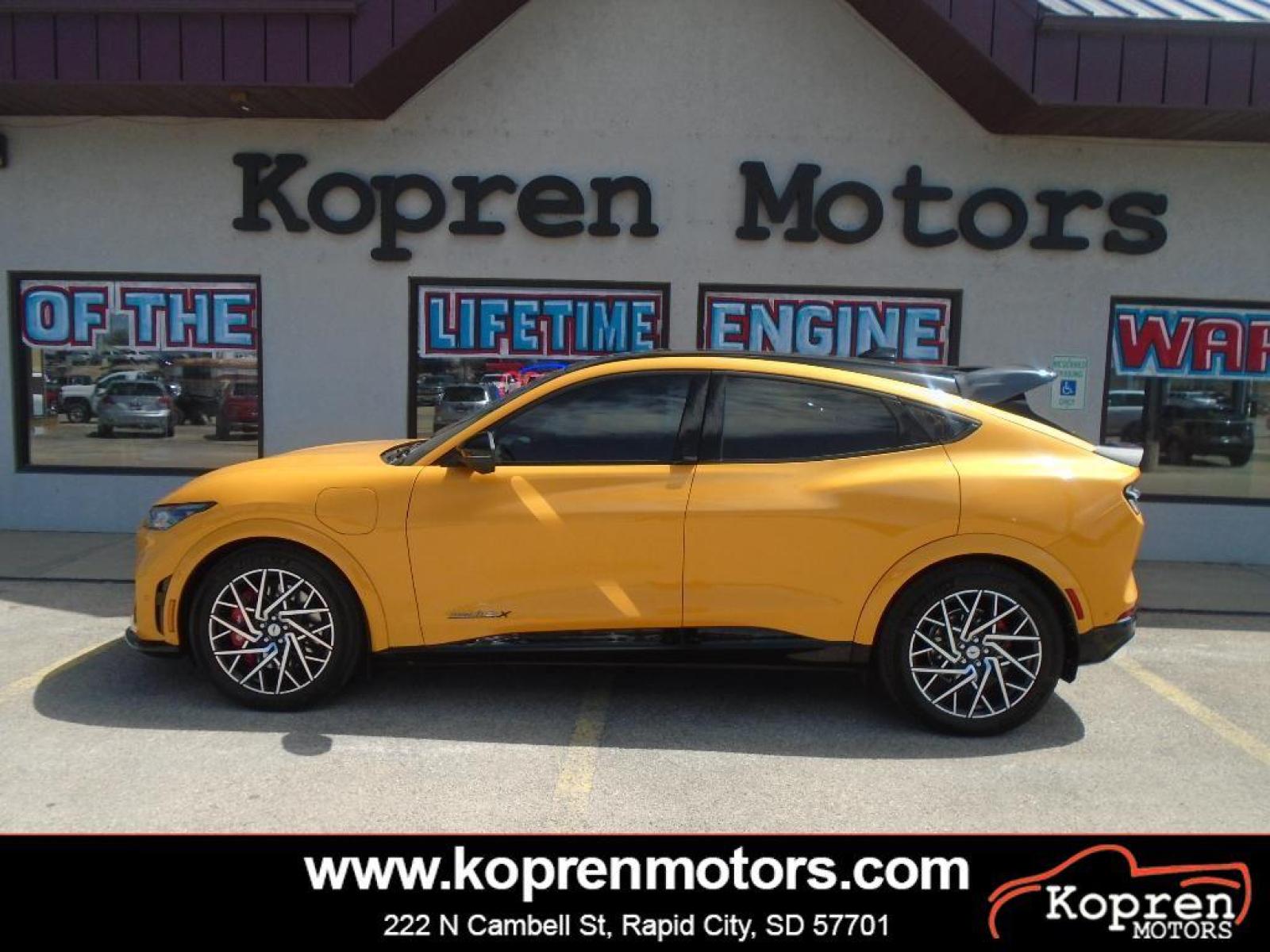 2021 Cyber Orange Metallic Tricoat /Gray w/Metallic Stitching Ford Mustang Mach-E GT (3FMTK4SX8MM) with an Electric Motor engine, Automatic transmission, located at 222 N Cambell St., Rapid City, SD, 57701, (866) 420-2727, 44.081833, -103.191032 - <b>Equipment</b><br>This model features a hands-free Bluetooth phone system. This vehicle is pure luxury with a heated steering wheel. You'll never again be lost in a crowded city or a country region with the navigation system on this 2021 Ford Mustang Mach-E . Protect this Ford Mustang Mach-E from - Photo #0