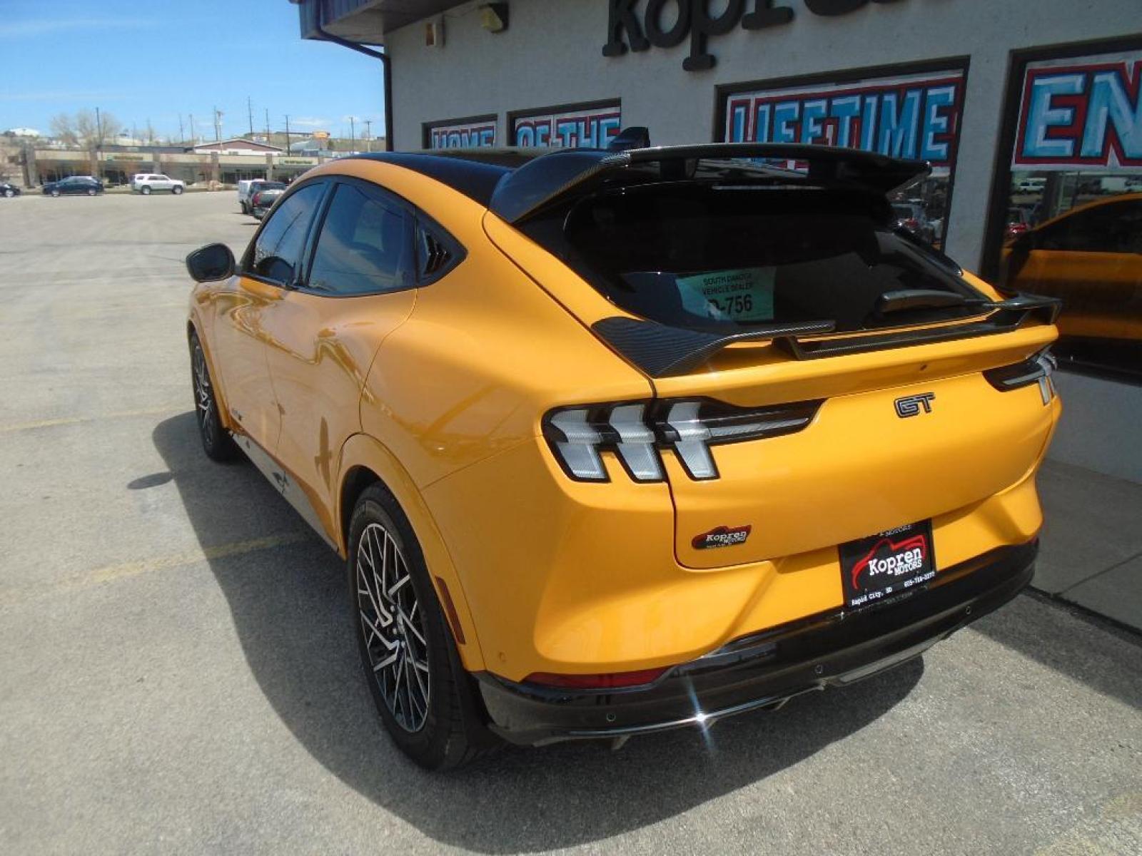 2021 Cyber Orange Metallic Tricoat /Gray w/Metallic Stitching Ford Mustang Mach-E GT (3FMTK4SX8MM) with an Electric Motor engine, Automatic transmission, located at 222 N Cambell St., Rapid City, SD, 57701, (866) 420-2727, 44.081833, -103.191032 - <b>Equipment</b><br>This model features a hands-free Bluetooth phone system. This vehicle is pure luxury with a heated steering wheel. You'll never again be lost in a crowded city or a country region with the navigation system on this 2021 Ford Mustang Mach-E . Protect this Ford Mustang Mach-E from - Photo #1