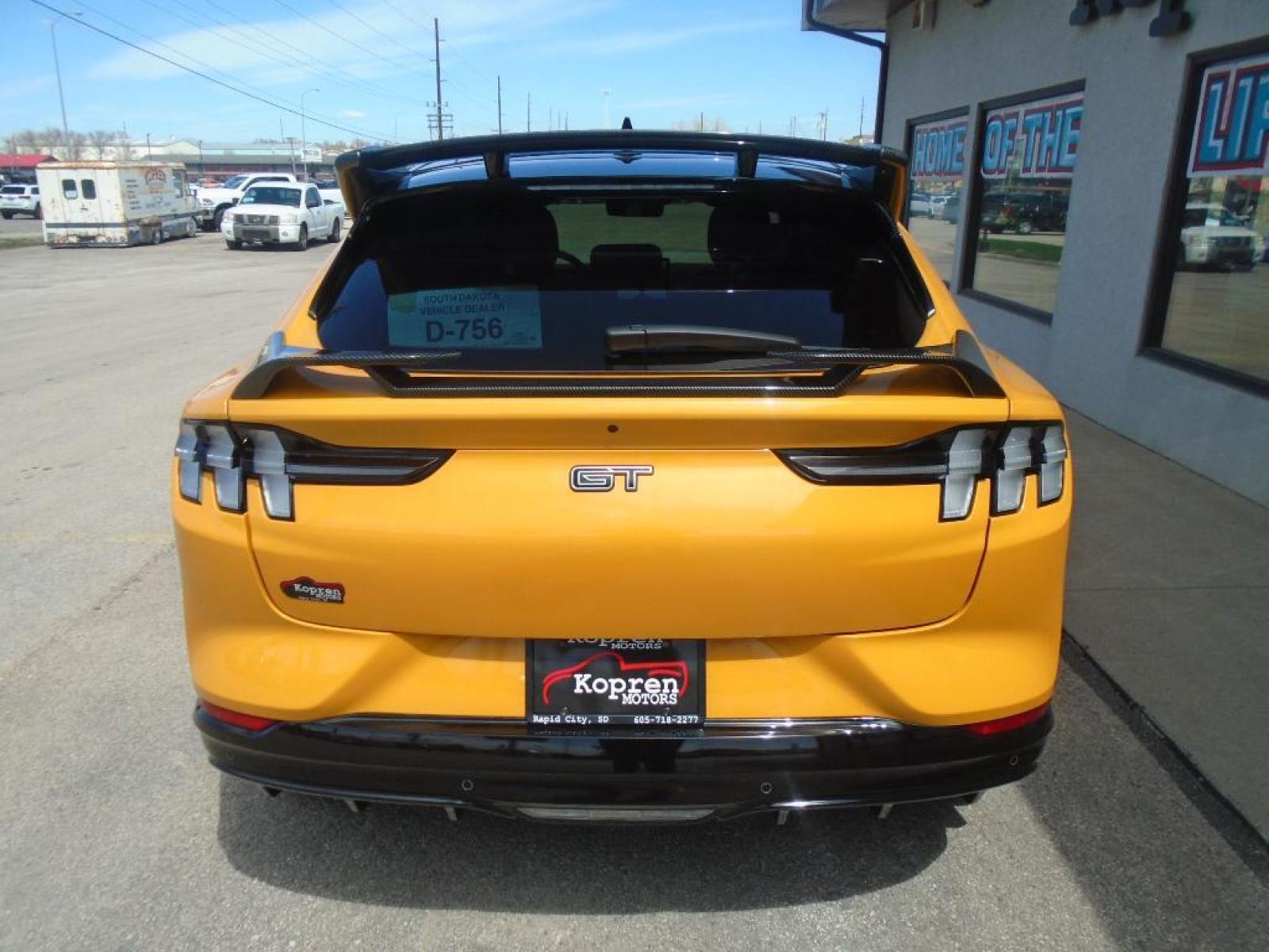 2021 Cyber Orange Metallic Tricoat /Gray w/Metallic Stitching Ford Mustang Mach-E GT (3FMTK4SX8MM) with an Electric Motor engine, Automatic transmission, located at 222 N Cambell St., Rapid City, SD, 57701, (866) 420-2727, 44.081833, -103.191032 - <b>Equipment</b><br>This model features a hands-free Bluetooth phone system. This vehicle is pure luxury with a heated steering wheel. You'll never again be lost in a crowded city or a country region with the navigation system on this 2021 Ford Mustang Mach-E . Protect this Ford Mustang Mach-E from - Photo #2