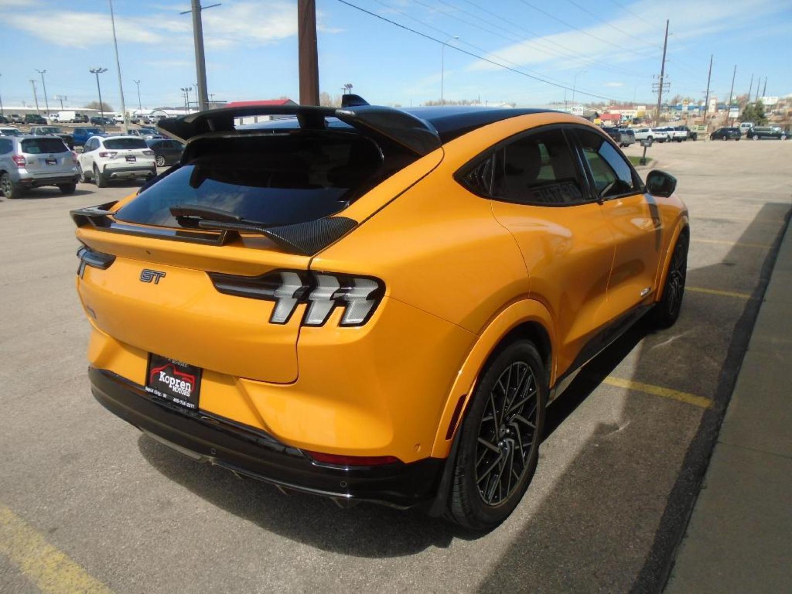 2021 Cyber Orange Metallic Tricoat /Gray w/Metallic Stitching Ford Mustang Mach-E GT (3FMTK4SX8MM) with an Electric Motor engine, Automatic transmission, located at 222 N Cambell St., Rapid City, SD, 57701, (866) 420-2727, 44.081833, -103.191032 - <b>Equipment</b><br>This model features a hands-free Bluetooth phone system. This vehicle is pure luxury with a heated steering wheel. You'll never again be lost in a crowded city or a country region with the navigation system on this 2021 Ford Mustang Mach-E . Protect this Ford Mustang Mach-E from - Photo #3