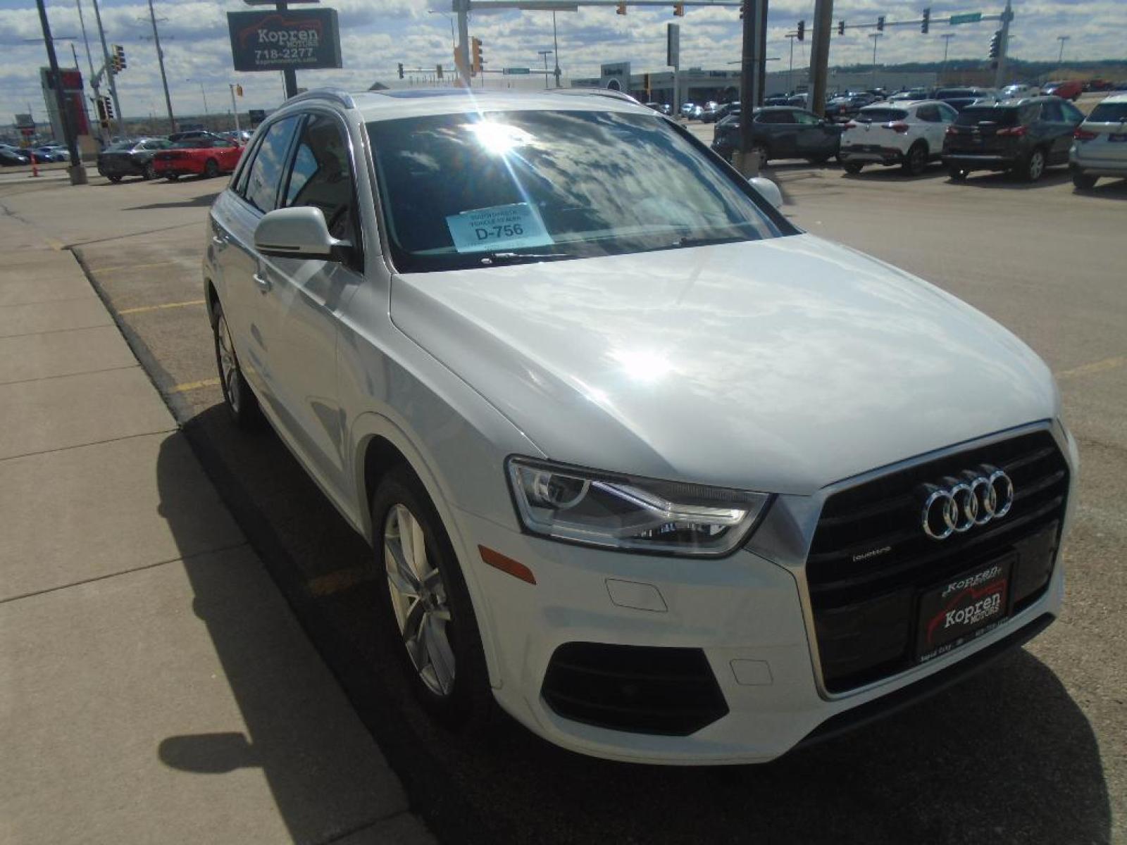 2016 Glacier White Metallic /Black Audi Q3 Premium Plus (WA1EFCFS4GR) with an L4, 2.0L engine, 6-speed automatic transmission, located at 222 N Cambell St., Rapid City, SD, 57701, (866) 420-2727, 44.081833, -103.191032 - <b>Equipment</b><br>Bluetooth technology is built into it, keeping your hands on the steering wheel and your focus on the road. Protect the Audi Q3 from unwanted accidents with a cutting edge backup camera system. This Audi Q3 has a clean CARFAX vehicle history report. See the road and the surroundi - Photo #4