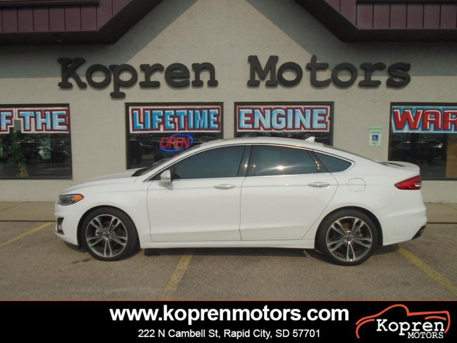 2019 Oxford White /Ebony Ford Fusion SEL (3FA6P0CD7KR) with an L4, 1.5L engine, 6-speed automatic transmission, located at 222 N Cambell St., Rapid City, SD, 57701, (866) 420-2727, 44.081833, -103.191032 - <b>Equipment</b><br>The rear parking assist technology on this model will put you at ease when reversing. The system alerts you as you get closer to an obstruction. This Ford Fusion features a hands-free Bluetooth phone system. See what's behind you with the back up camera on this unit. Set the tem - Photo #0