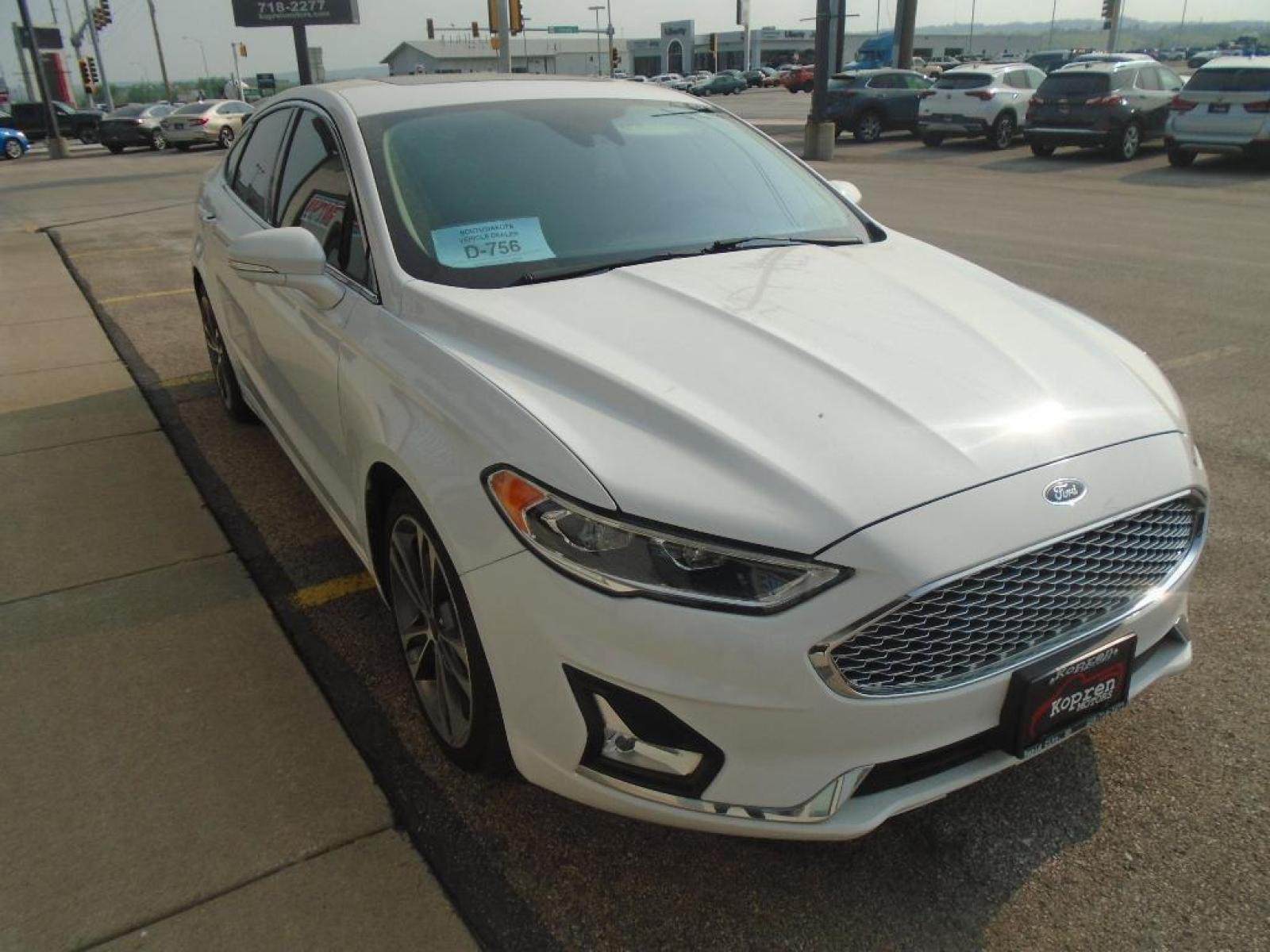 2019 Oxford White /Ebony Ford Fusion SEL (3FA6P0CD7KR) with an L4, 1.5L engine, 6-speed automatic transmission, located at 222 N Cambell St., Rapid City, SD, 57701, (866) 420-2727, 44.081833, -103.191032 - <b>Equipment</b><br>The rear parking assist technology on this model will put you at ease when reversing. The system alerts you as you get closer to an obstruction. This Ford Fusion features a hands-free Bluetooth phone system. See what's behind you with the back up camera on this unit. Set the tem - Photo #4