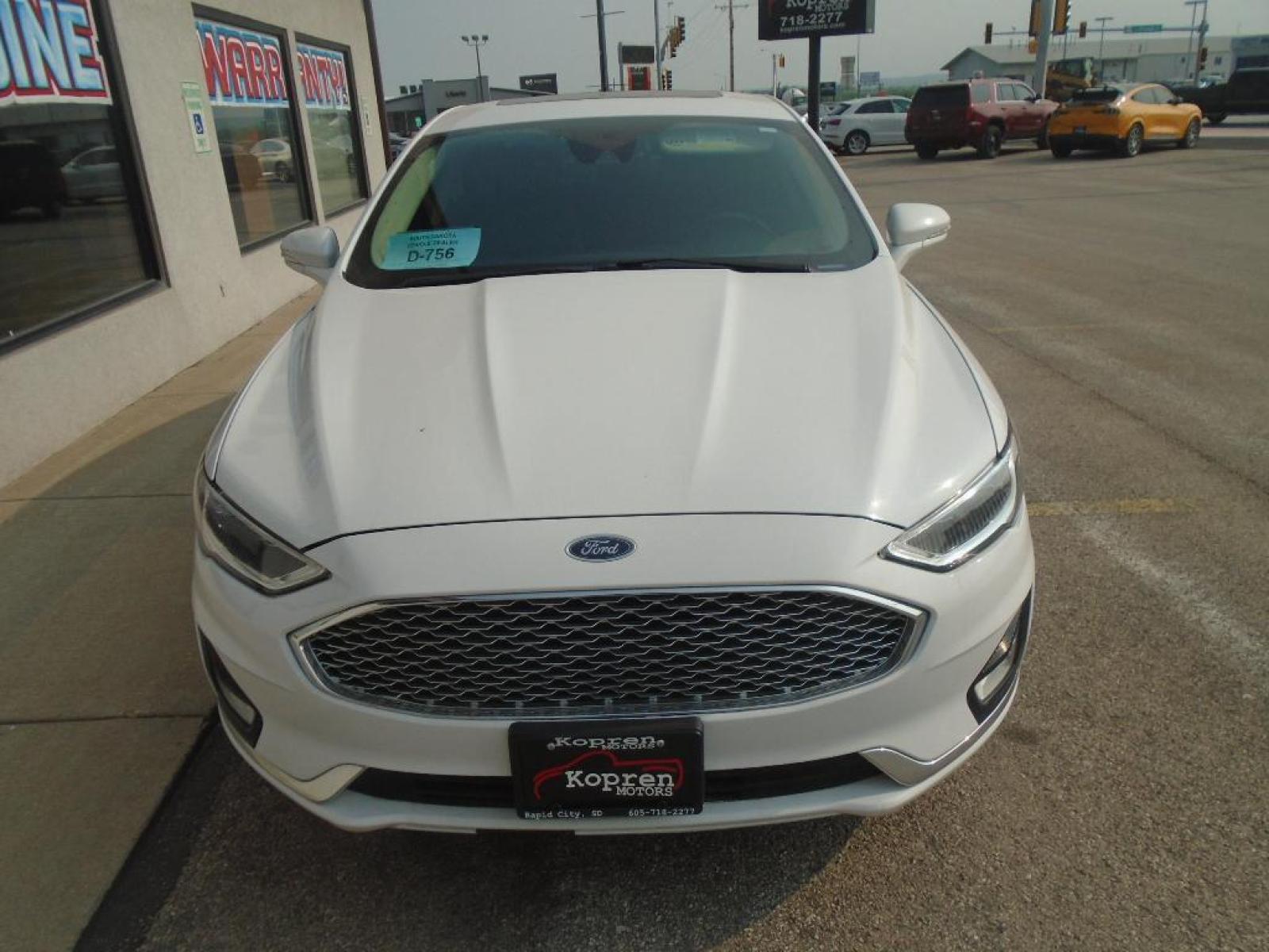 2019 Oxford White /Ebony Ford Fusion SEL (3FA6P0CD7KR) with an L4, 1.5L engine, 6-speed automatic transmission, located at 222 N Cambell St., Rapid City, SD, 57701, (866) 420-2727, 44.081833, -103.191032 - <b>Equipment</b><br>The rear parking assist technology on this model will put you at ease when reversing. The system alerts you as you get closer to an obstruction. This Ford Fusion features a hands-free Bluetooth phone system. See what's behind you with the back up camera on this unit. Set the tem - Photo #5