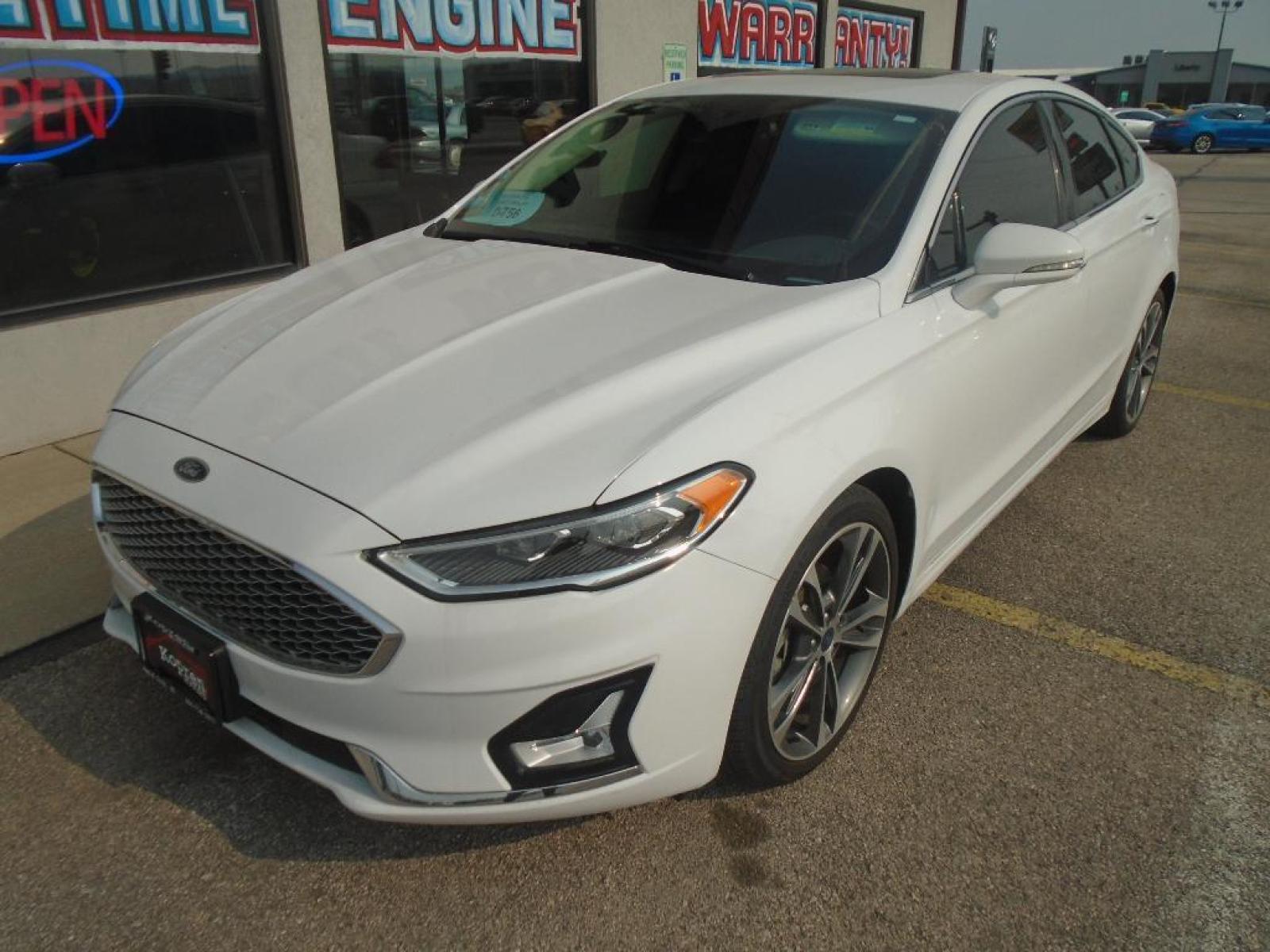 2019 Oxford White /Ebony Ford Fusion SEL (3FA6P0CD7KR) with an L4, 1.5L engine, 6-speed automatic transmission, located at 222 N Cambell St., Rapid City, SD, 57701, (866) 420-2727, 44.081833, -103.191032 - <b>Equipment</b><br>The rear parking assist technology on this model will put you at ease when reversing. The system alerts you as you get closer to an obstruction. This Ford Fusion features a hands-free Bluetooth phone system. See what's behind you with the back up camera on this unit. Set the tem - Photo #6