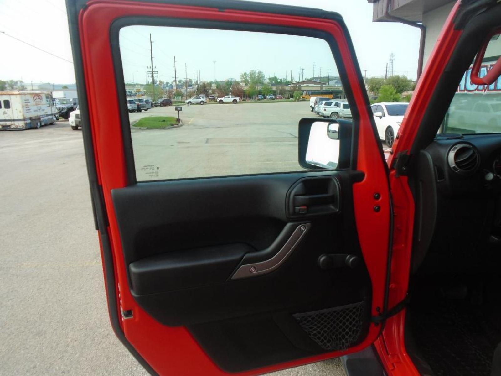 2018 RED /Black Jeep Wrangler Unlimited JK Willys Wheeler (1C4BJWDG0JL) with an V6, 3.6L engine, 5-speed automatic transmission, located at 222 N Cambell St., Rapid City, SD, 57701, (866) 420-2727, 44.081833, -103.191032 - <b>Equipment</b><br>Our dealership has already run the CARFAX report and it is clean. A clean CARFAX is a great asset for resale value in the future. It features a hands-free Bluetooth phone system. This vehicle has four wheel drive capabilities. This small suv is painted with a sleek and sophistic - Photo #9
