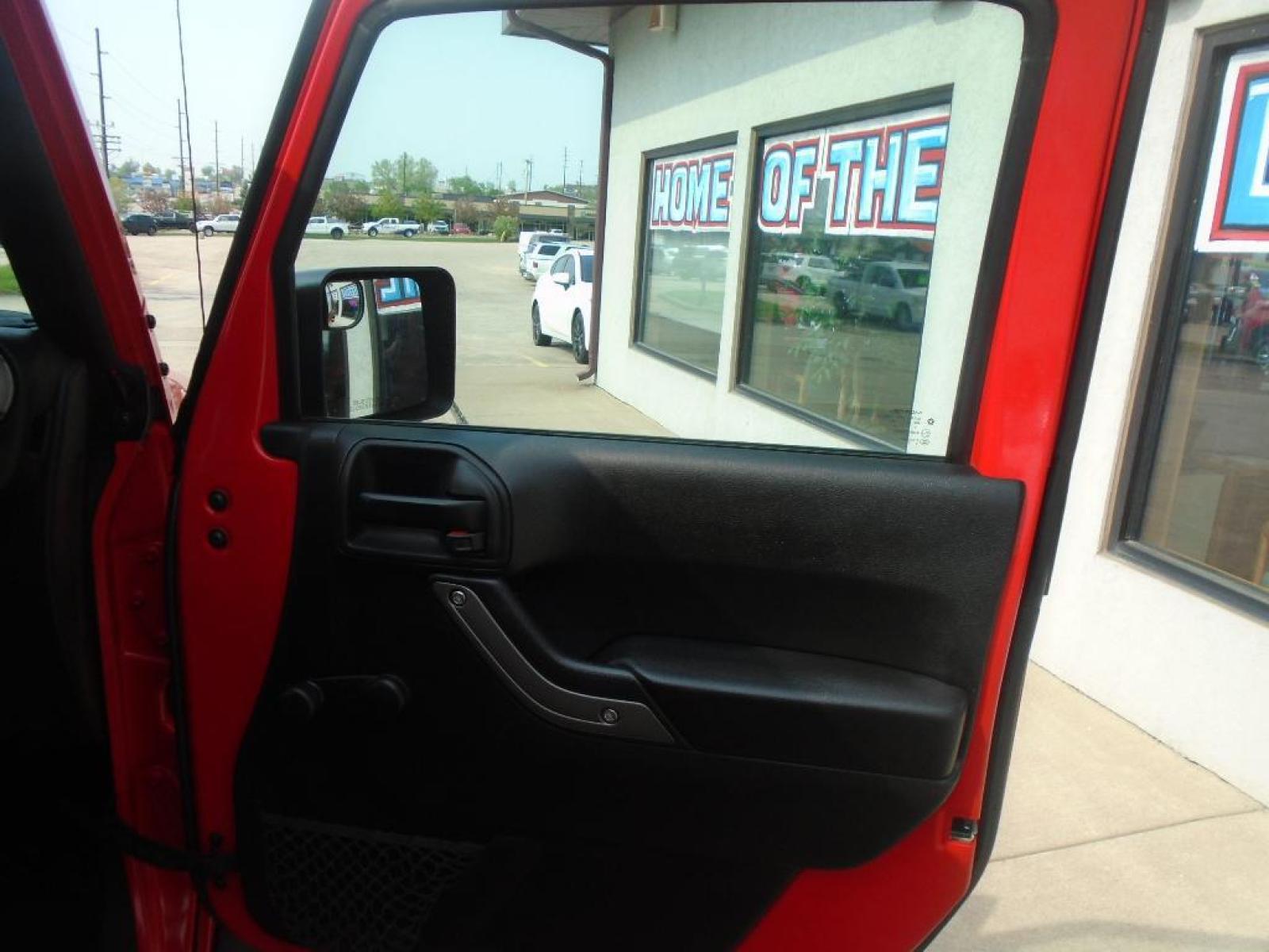 2018 RED /Black Jeep Wrangler Unlimited JK Willys Wheeler (1C4BJWDG0JL) with an V6, 3.6L engine, 5-speed automatic transmission, located at 222 N Cambell St., Rapid City, SD, 57701, (866) 420-2727, 44.081833, -103.191032 - <b>Equipment</b><br>Our dealership has already run the CARFAX report and it is clean. A clean CARFAX is a great asset for resale value in the future. It features a hands-free Bluetooth phone system. This vehicle has four wheel drive capabilities. This small suv is painted with a sleek and sophistic - Photo #22