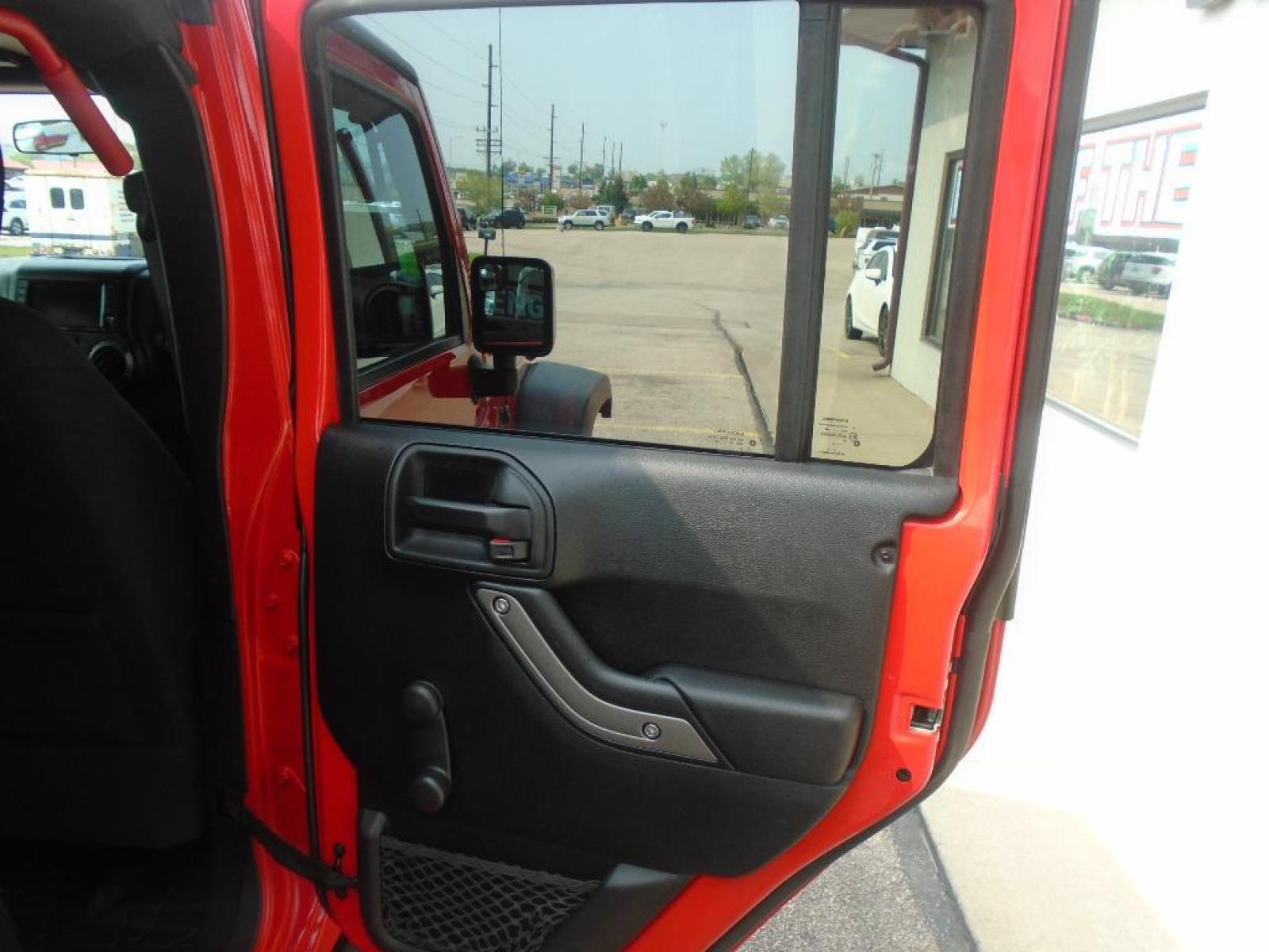 2018 RED /Black Jeep Wrangler Unlimited JK Willys Wheeler (1C4BJWDG0JL) with an V6, 3.6L engine, 5-speed automatic transmission, located at 222 N Cambell St., Rapid City, SD, 57701, (866) 420-2727, 44.081833, -103.191032 - <b>Equipment</b><br>Our dealership has already run the CARFAX report and it is clean. A clean CARFAX is a great asset for resale value in the future. It features a hands-free Bluetooth phone system. This vehicle has four wheel drive capabilities. This small suv is painted with a sleek and sophistic - Photo #25