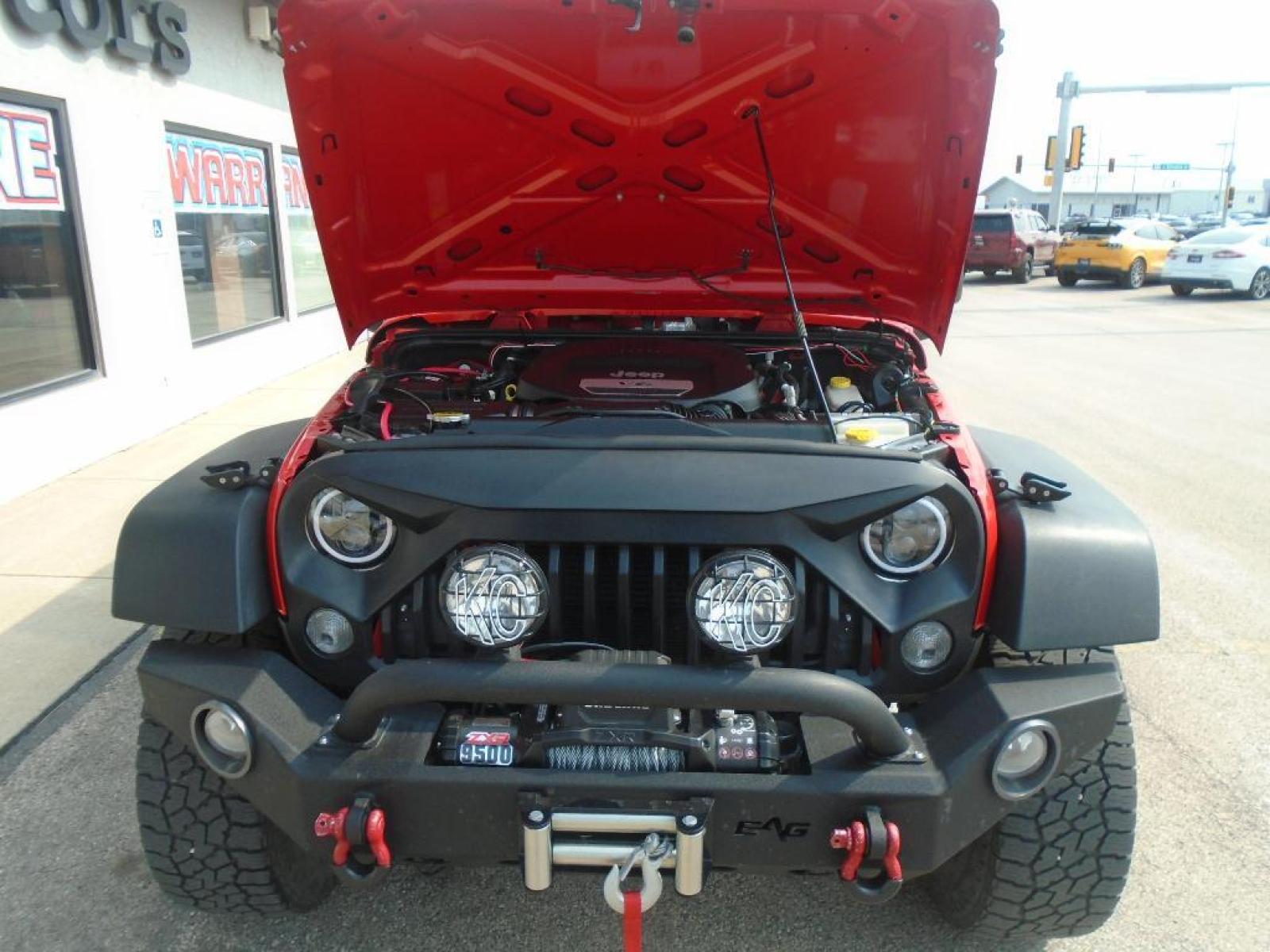 2018 RED /Black Jeep Wrangler Unlimited JK Willys Wheeler (1C4BJWDG0JL) with an V6, 3.6L engine, 5-speed automatic transmission, located at 222 N Cambell St., Rapid City, SD, 57701, (866) 420-2727, 44.081833, -103.191032 - <b>Equipment</b><br>Our dealership has already run the CARFAX report and it is clean. A clean CARFAX is a great asset for resale value in the future. It features a hands-free Bluetooth phone system. This vehicle has four wheel drive capabilities. This small suv is painted with a sleek and sophistic - Photo #31