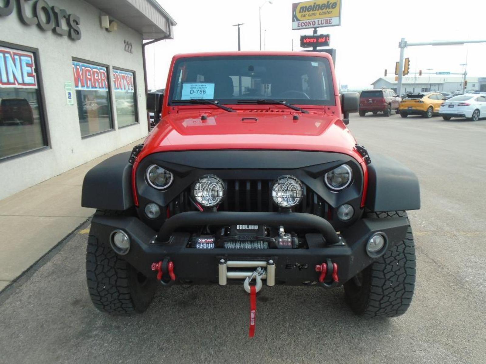 2018 RED /Black Jeep Wrangler Unlimited JK Willys Wheeler (1C4BJWDG0JL) with an V6, 3.6L engine, 5-speed automatic transmission, located at 222 N Cambell St., Rapid City, SD, 57701, (866) 420-2727, 44.081833, -103.191032 - <b>Equipment</b><br>Our dealership has already run the CARFAX report and it is clean. A clean CARFAX is a great asset for resale value in the future. It features a hands-free Bluetooth phone system. This vehicle has four wheel drive capabilities. This small suv is painted with a sleek and sophistic - Photo #5