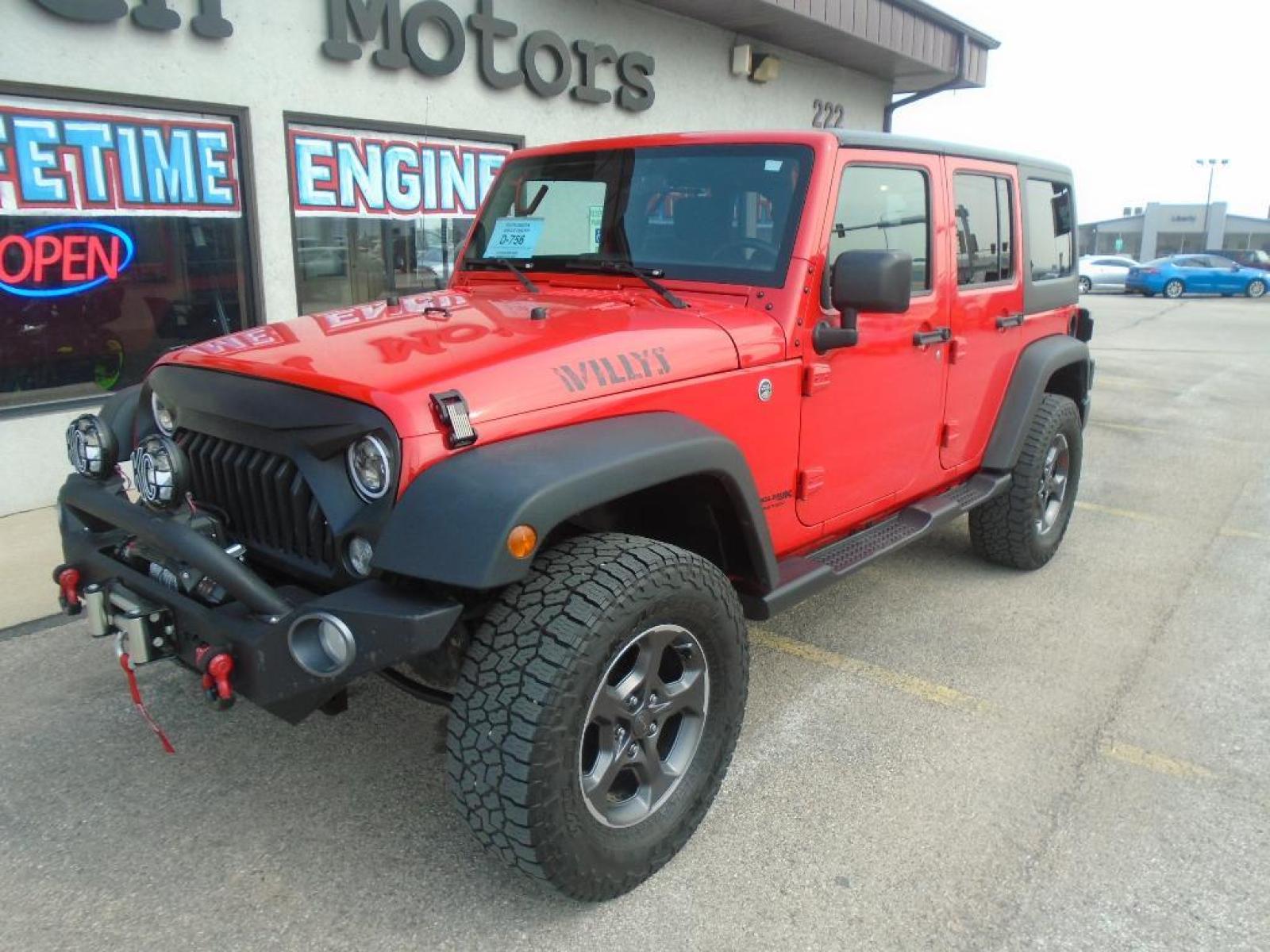 2018 RED /Black Jeep Wrangler Unlimited JK Willys Wheeler (1C4BJWDG0JL) with an V6, 3.6L engine, 5-speed automatic transmission, located at 222 N Cambell St., Rapid City, SD, 57701, (866) 420-2727, 44.081833, -103.191032 - <b>Equipment</b><br>Our dealership has already run the CARFAX report and it is clean. A clean CARFAX is a great asset for resale value in the future. It features a hands-free Bluetooth phone system. This vehicle has four wheel drive capabilities. This small suv is painted with a sleek and sophistic - Photo #6