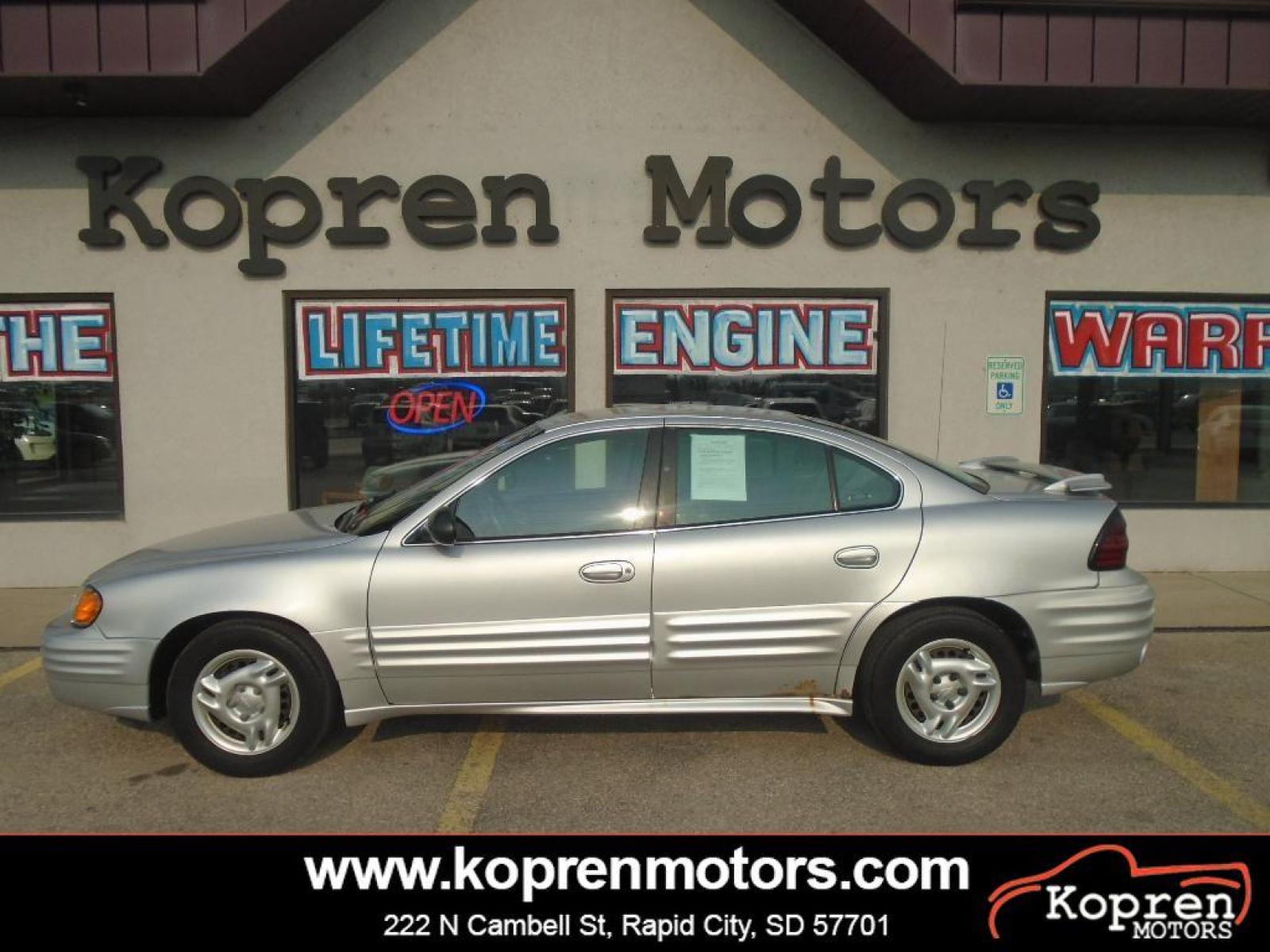 2002 Galaxy Silver Metallic Pontiac Grand Am SE1 (1G2NF52F22C) with an L4, 2.2L engine, 5-speed manual transmission, located at 222 N Cambell St., Rapid City, SD, 57701, (866) 420-2727, 44.081833, -103.191032 - The Pontiac Grand Am shines with an exquisite metallic silver exterior finish. The vehicle has a L4, 2.2L high output engine. This model is front wheel drive. Maintaining a stable interior temperature in this 2002 Pontiac Grand Am is easy with the climate control system. Anti-lock brakes are standa - Photo #0