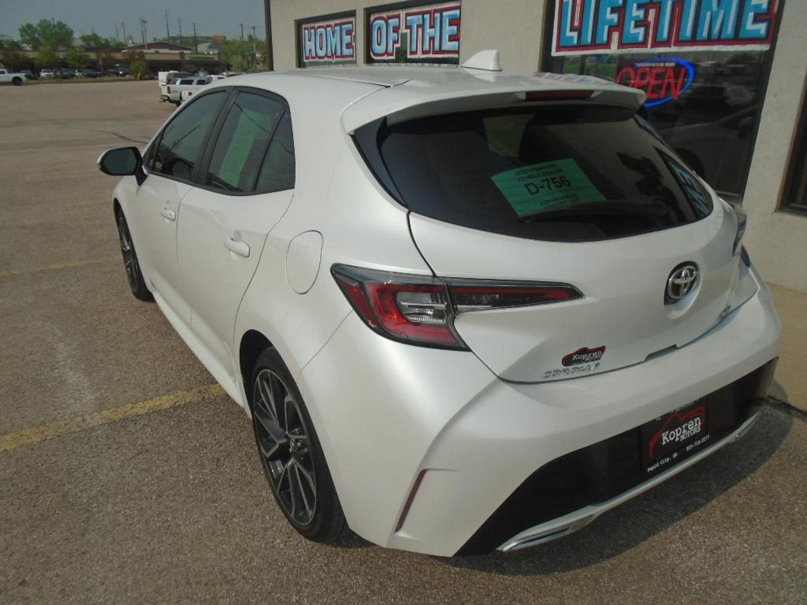 2021 Wind Chill Pearl /Moonstone Toyota Corolla Hatchback XSE (JTNA4MBE5M3) with an L4, 2.0L engine, 6-speed manual transmission, located at 222 N Cambell St., Rapid City, SD, 57701, (866) 420-2727, 44.081833, -103.191032 - <b>Equipment</b><br>Protect this Toyota Corolla Hatchback from unwanted accidents with a cutting edge backup camera system. It features a hands-free Bluetooth phone system. Our dealership has already run the CARFAX report and it is clean. A clean CARFAX is a great asset for resale value in the futu - Photo #1