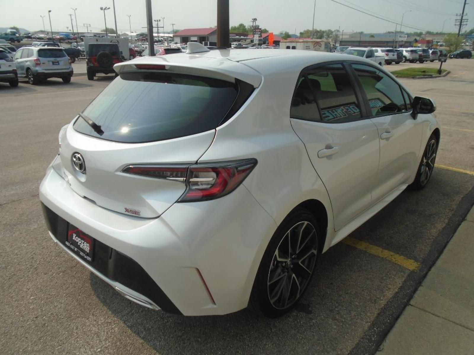 2021 Wind Chill Pearl /Moonstone Toyota Corolla Hatchback XSE (JTNA4MBE5M3) with an L4, 2.0L engine, 6-speed manual transmission, located at 222 N Cambell St., Rapid City, SD, 57701, (866) 420-2727, 44.081833, -103.191032 - <b>Equipment</b><br>Protect this Toyota Corolla Hatchback from unwanted accidents with a cutting edge backup camera system. It features a hands-free Bluetooth phone system. Our dealership has already run the CARFAX report and it is clean. A clean CARFAX is a great asset for resale value in the futu - Photo #3